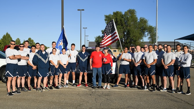 Gold Star Mother Cathy Powers with her “AMMO family” June 21, 2019, at Hill Air Force Base, Utah. Munitions Airmen assigned to the 388th and 419th Fighter Wings and the 649th Munitions Squadron ran a 5K with Cathy whose son, Senior Airman Bryce Powers, passed away April 26, 2013, after a vehicle accident in Japan. Cathy's goal is to run a total of 1,000 miles while visiting all 50 states to raise funds to sponsor veteran’s wreaths to be placed at Arlington National Cemetery in December. (U.S. Air Force photo by R. Nial Bradshaw)