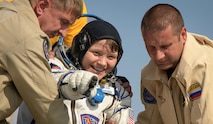 U.S. Army astronaut Lt. Col. Anne McClain exits the Soyuz MS-11 spacecraft minutes after she, Canadian Space Agency astronaut David Saint-Jacques, and Roscosmos cosmonaut Oleg Kononenko, land back on Earth June 24 (U.S. Eastern time). McClain returns after 204 days in space where she served as a member of the Expedition 58 and 59 crew onboard the International Space Station. (NASA photo by Bill Ingalls)