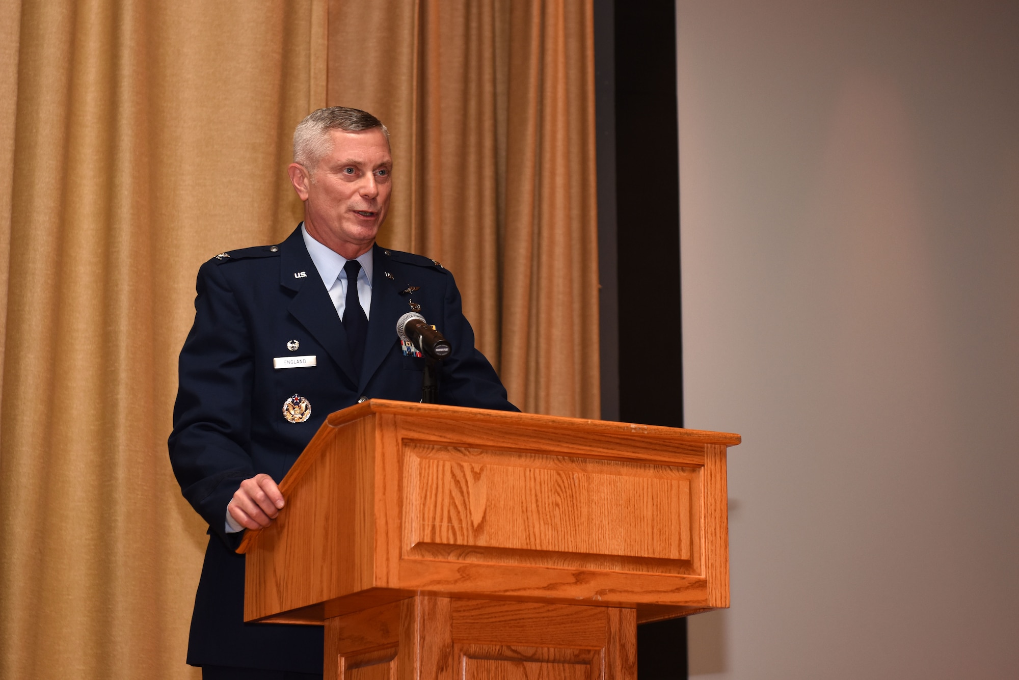 U.S. Air Force Col. Tony England, 17th Mission Support Group commander, delivers closing remarks during the Community College of the Air Force Commencement Ceremony at the base theater on Goodfellow Air Force Base, June 21, 2019. England spoke on his experience being prior enlisted and how earning his CCAF helped push him to receive more schooling and be accepted into Officer Training School. (U.S. Air Force photo by Senior Airman Seraiah Wolf/Released)