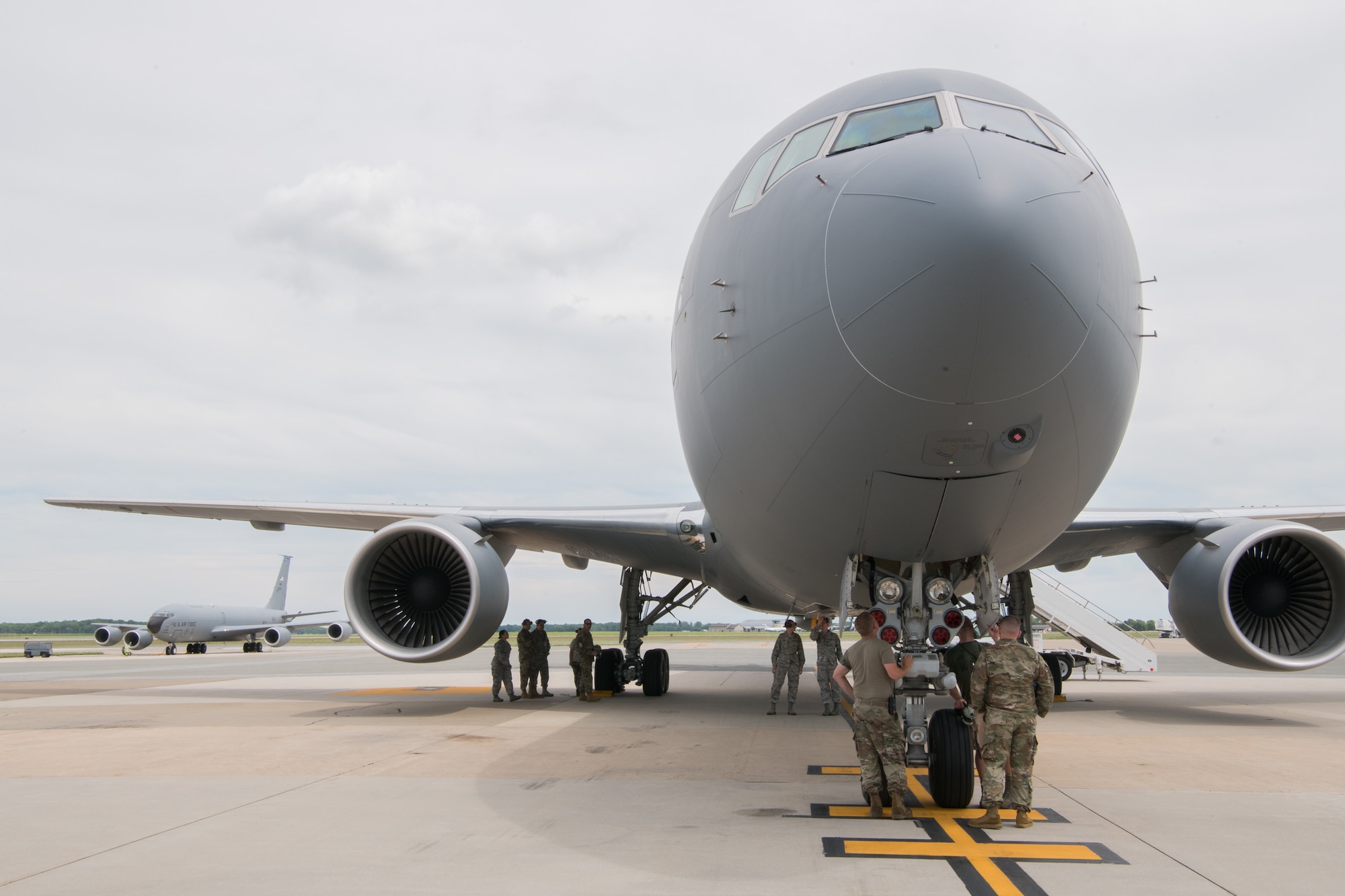 A KC-46A Pegasus belonging to the 344th Air Refueling Squadron sits on the flight line with a KC-135 behind it June 25, 2019, at Dover Air Force Base, Del. Several Team Dover Airmen and civilians came out to see the aircraft for the first time and familiarize themselves with its systems. (U.S. Air Force Photo by Mauricio Campino)