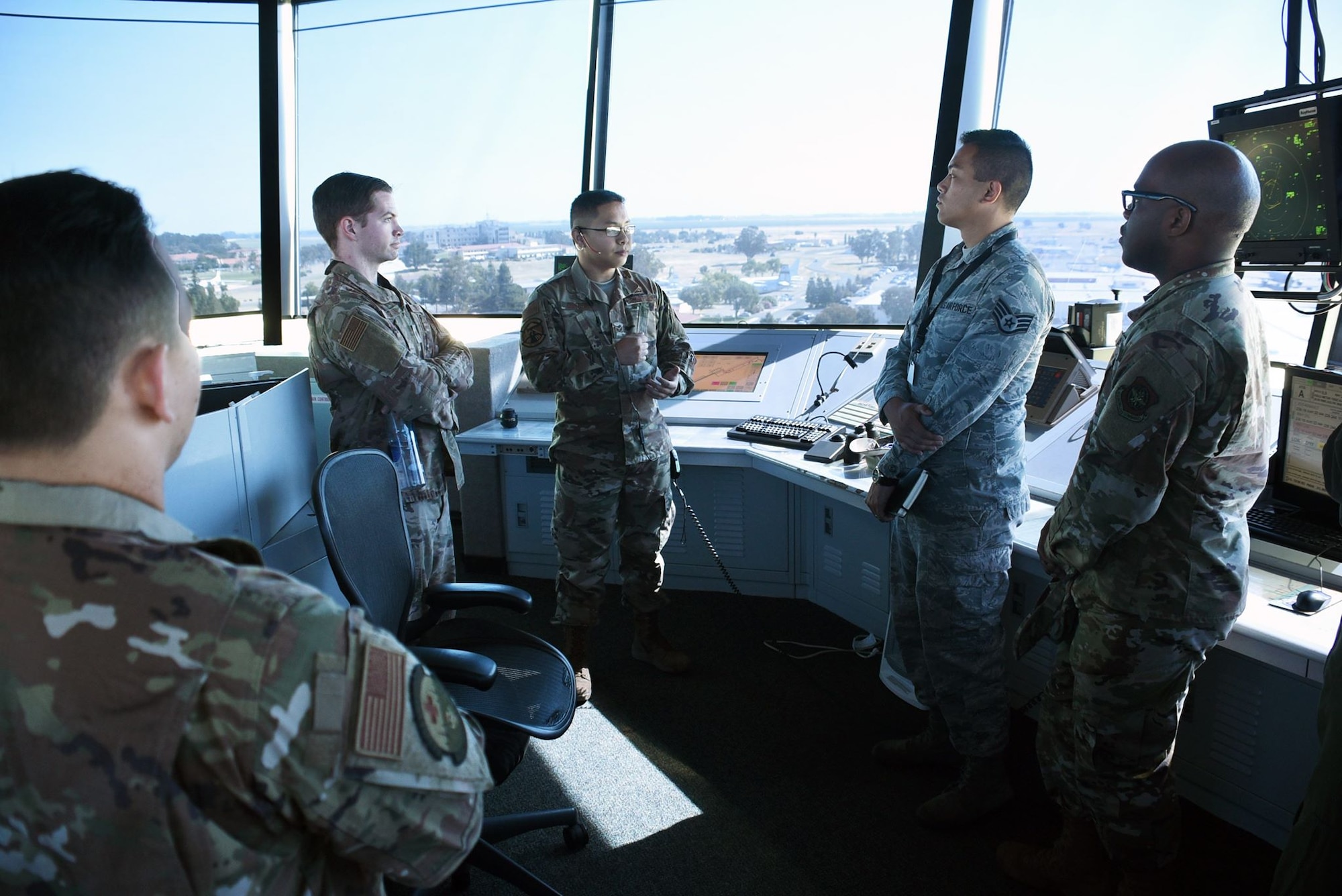 U.S. Air Force Airmen from the 60th Operations Support Squadron show participants of an Airman enrichment day the normal tasks carried out by air traffic control tower personnel on a daily basis June14, 2019, at Travis Air Force Base, California. The Airman enrichment day was the first of its kind in the Air Force and exposed Airmen of different units to the jobs and mission contributions of other Air Force jobs. (U.S. Air Force photo by Senior Airman Christian Conrad)
