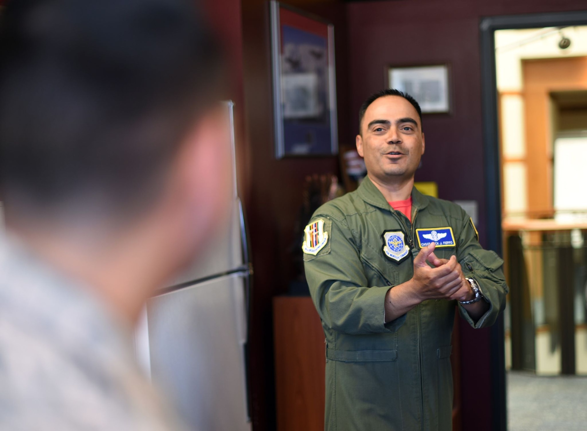 U.S. Air Force Chief Master Sgt. Erick Fierro, 9th Air Refueling Squadron superintendent, right, answers a question from Tech. Sgt. Adrian Perez, 60th Medical Support Squadron Client Service Center technician, left, during an Airman enrichment day June 14, 2019, at Travis Air Force Base, California. The Airman enrichment day was the first of its kind in the Air Force and exposed Airmen of different Travis units to the jobs and mission contributions of other Air Force jobs. (U.S. Air Force photo by Senior Airman Christian Conrad)