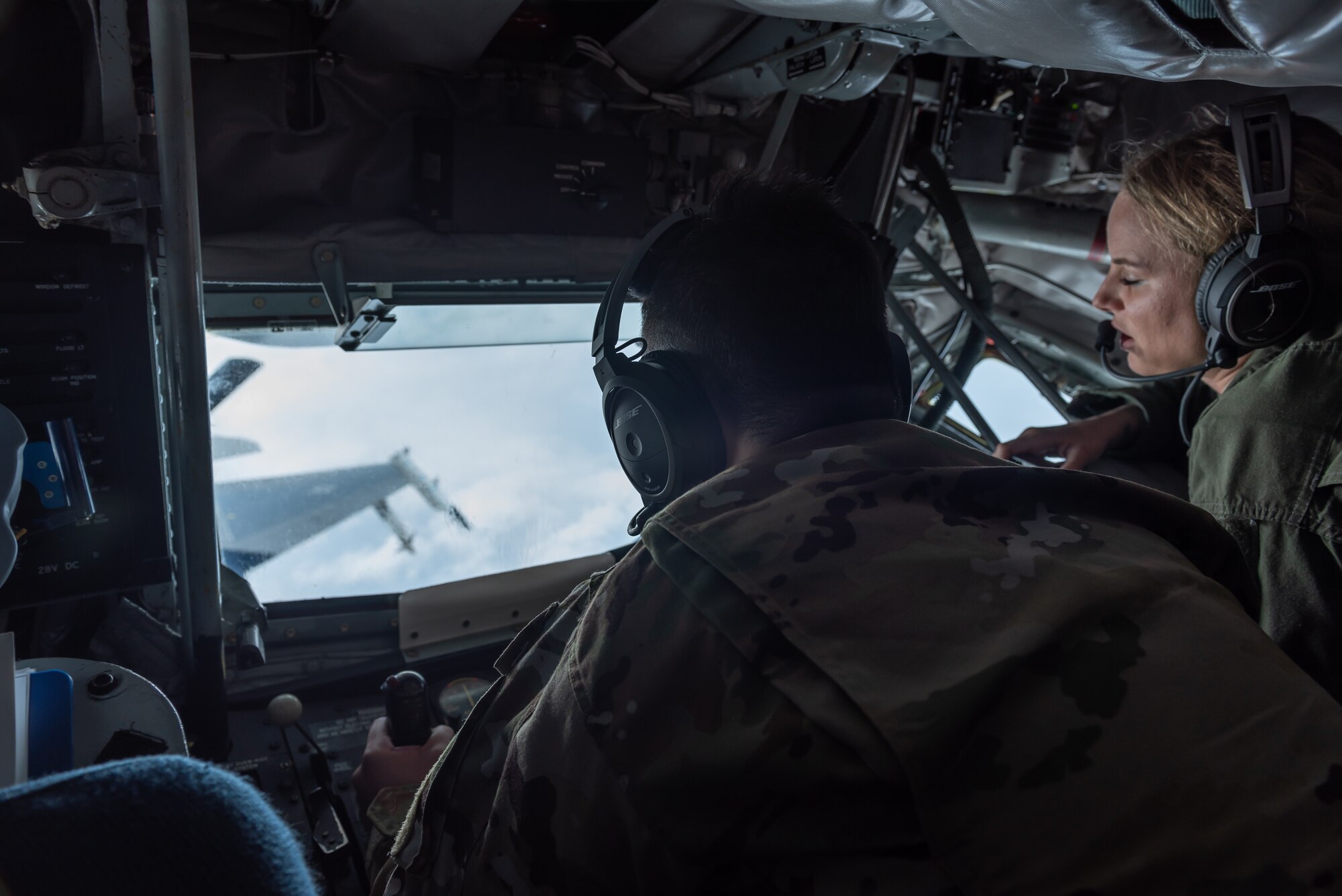 U.S. Air Force Airman 1st Class Liam Kilbane, 909th Air Refueling Squadron boom operator, works the controls in his boom pod during a training exercise June 18, 2019. The 909th ARS helps ensure a free-and-open Indo-Pacific by providing air refueling to U.S., allies and partners within the area of responsibility. (U.S. Air Force photo by Airman 1st Class Matthew Seefeldt)