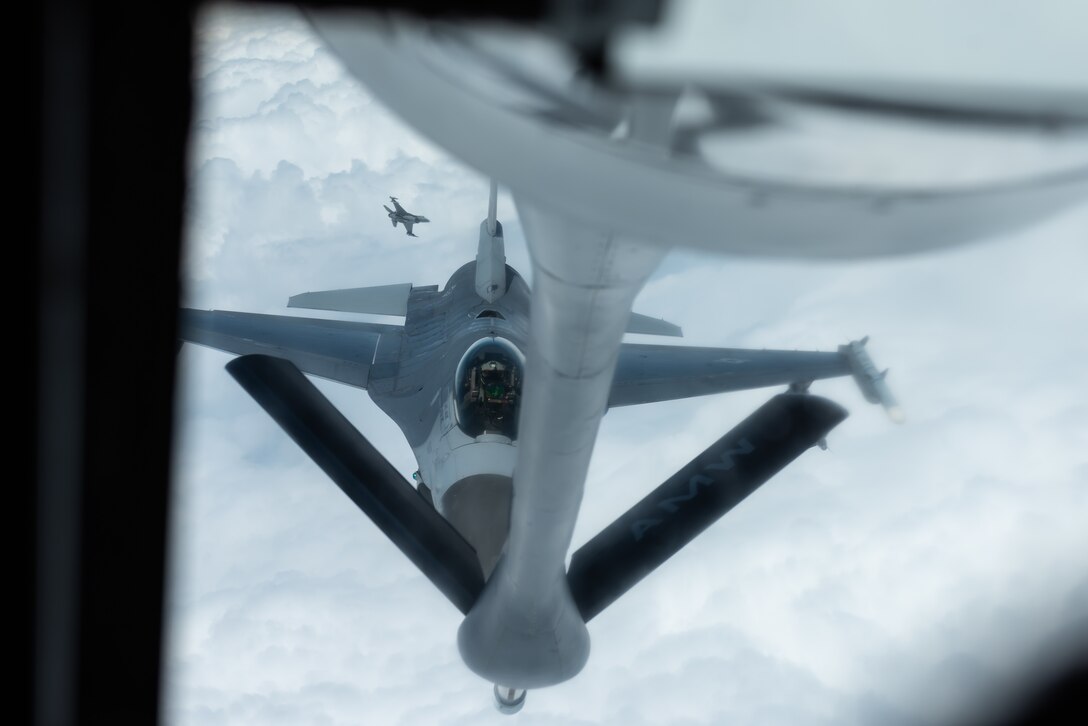 An F-16 Fighting Falcon from the 8th Fighter Wing, Kunsan Air Base, Republic of Korea, prepares to refuel with a KC-135 Stratotanker from the 909th Air Refueling Squadron, Kadena Air Base, Japan, during a training exercise June 18, 2019. The 909th ARS helps ensure a free-and-open Indo-Pacific by providing air refueling to U.S., allies and partners within the area of responsibility. (U.S. Air Force photo by Airman 1st Class Matthew Seefeldt)