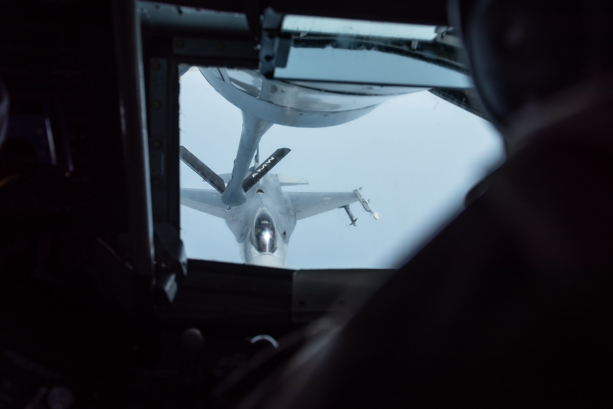 An F-16 Fighting Falcon from the 8th Fighter Wing, Kunsan Air Base, Republic of Korea, prepares to refuel with a KC-135 Stratotanker from the 909th Air Refueling Squadron, Kadena Air Base, Japan, during a training exercise June 18, 2019. The 909th ARS helps ensure a free-and-open Indo-Pacific by providing air refueling to U.S., allies and partners within the area of responsibility. (U.S. Air Force photo by Airman 1st Class Matthew Seefeldt)