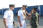 JAKARTA, Indonesia (June 25, 2019) Indonesian Navy officers greet USS Patriot (MCM 7) leadership during an arrival ceremony in Jakarta, Indonesia. Patriot, part of Mine Countermeasures Squadron 7, is operating in the U.S. 7th Fleet area of operations to enhance interoperability with partners and serve as a ready-response platform for contingency operations.