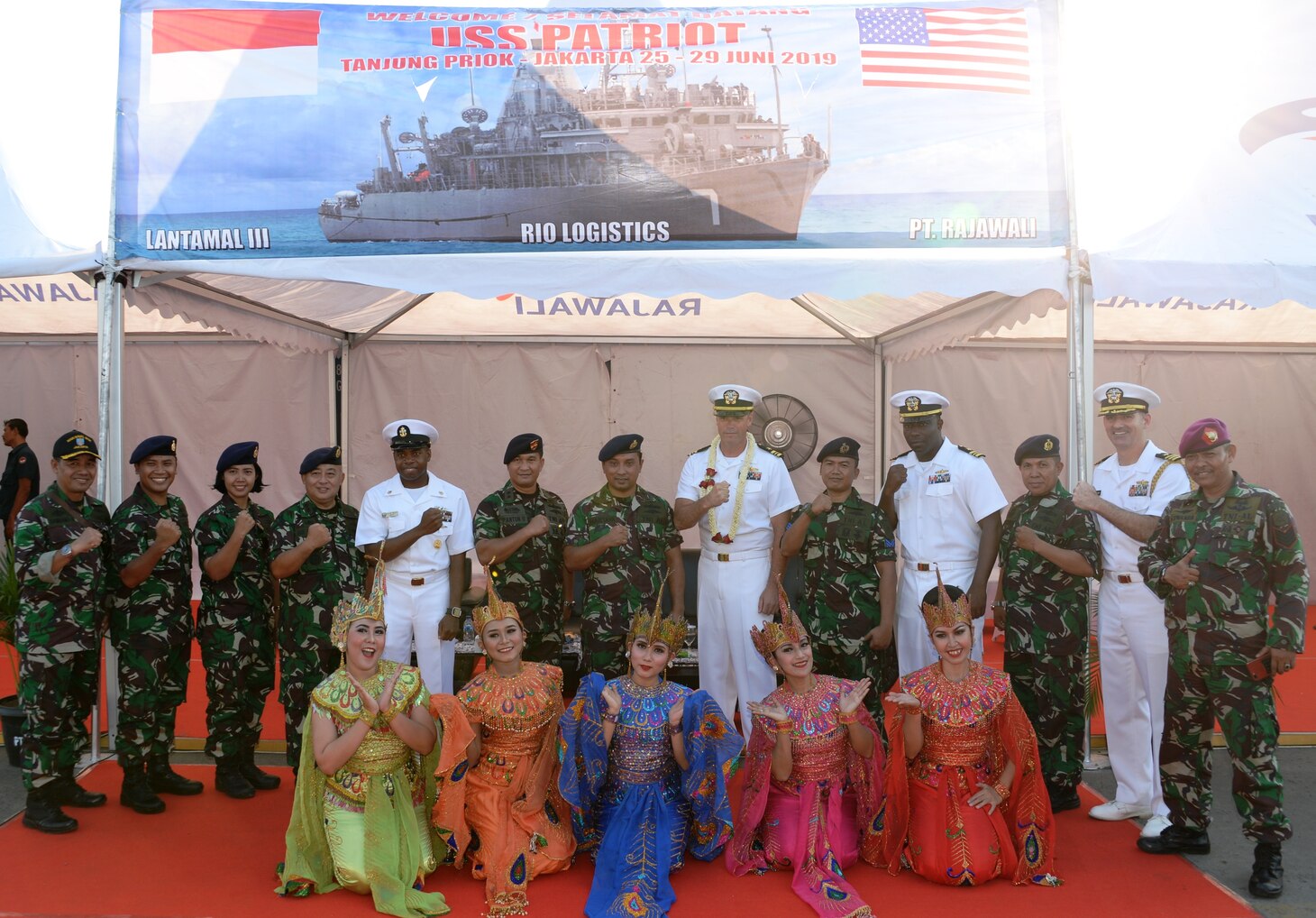 JAKARTA, Indonesia (June 25, 2019) USS Patriot (MCM 7) leadership pose for a photograph with Indonesian military and dignitaries during an arrival ceremony in Jakarta, Indonesia. Patriot, part of Mine Countermeasures Squadron 7, is operating in the U.S. 7th Fleet area of operation to enhance interoperability with partners and serve as a ready-response platform for contingency operations.
