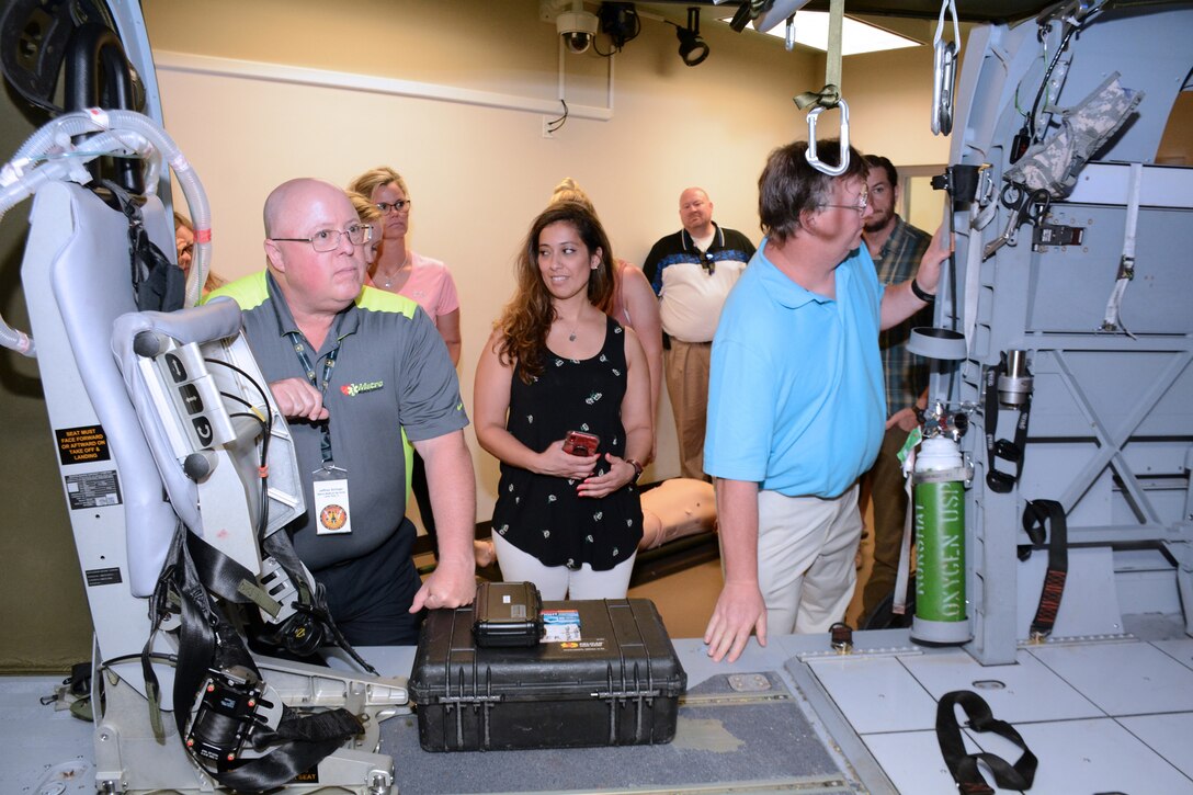 A group of educators from the Wisconsin and Northern Illinois area tour the Flight Paramedic Simulator at Joint Base San Antonio-Fort Sam Houston, Texas during an educator's tour hosted by the U.S. Army Medical Department Center and School, Health Readiness Center of Excellence commanding general and command sergeant major, on June 11, 2019. The tour was conducted in support of the U.S. Army Recruiting Command mission to help educators understand the career opportunities available for their students through military service in the U.S. Army.
