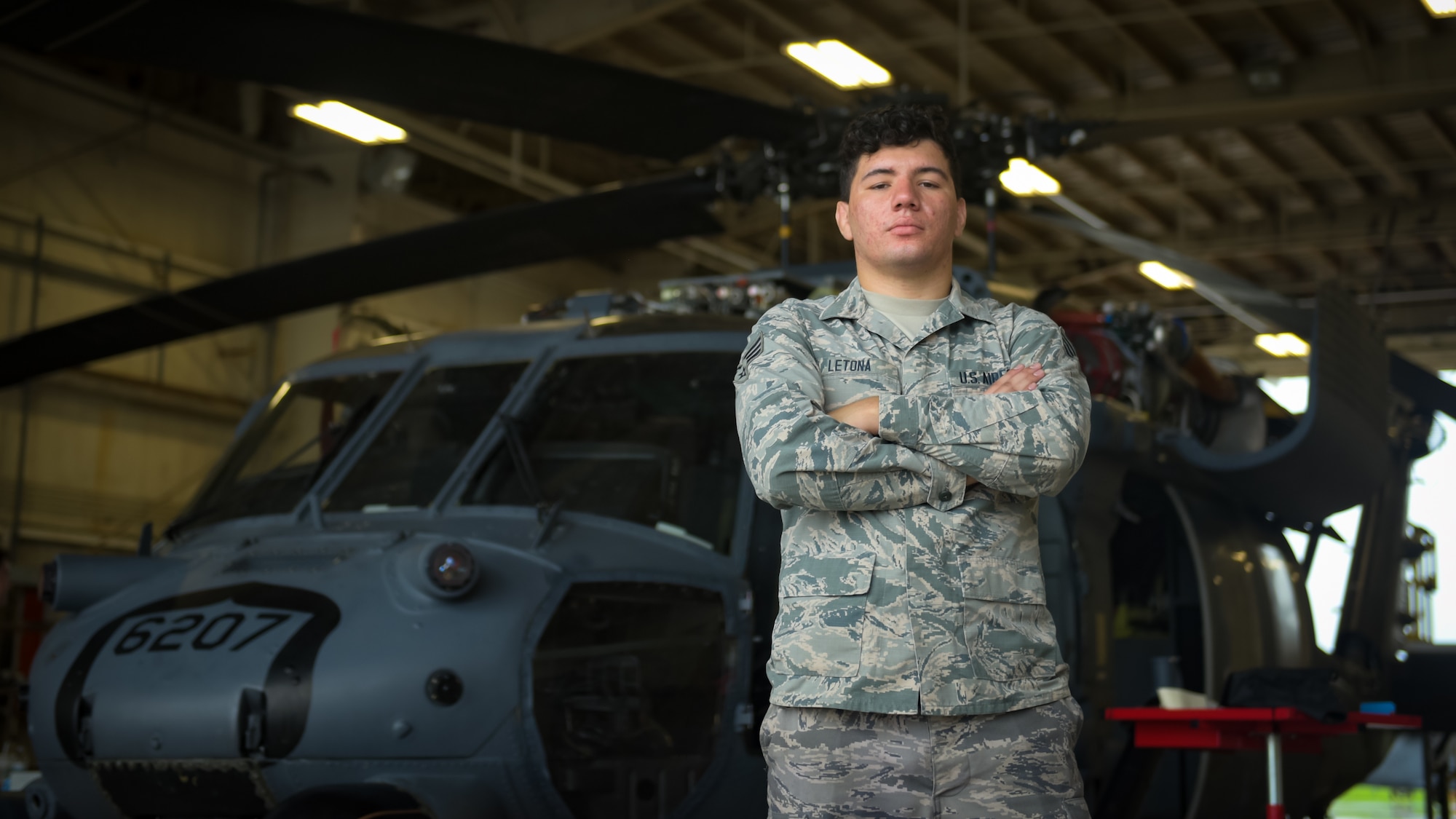 Senior Airman Joshua Letona, aircraft inspection journeyman assigned to the 718th Aircraft Maintenance Squadron, poses for a photo on Kadena Air Base, June 25, 2019.