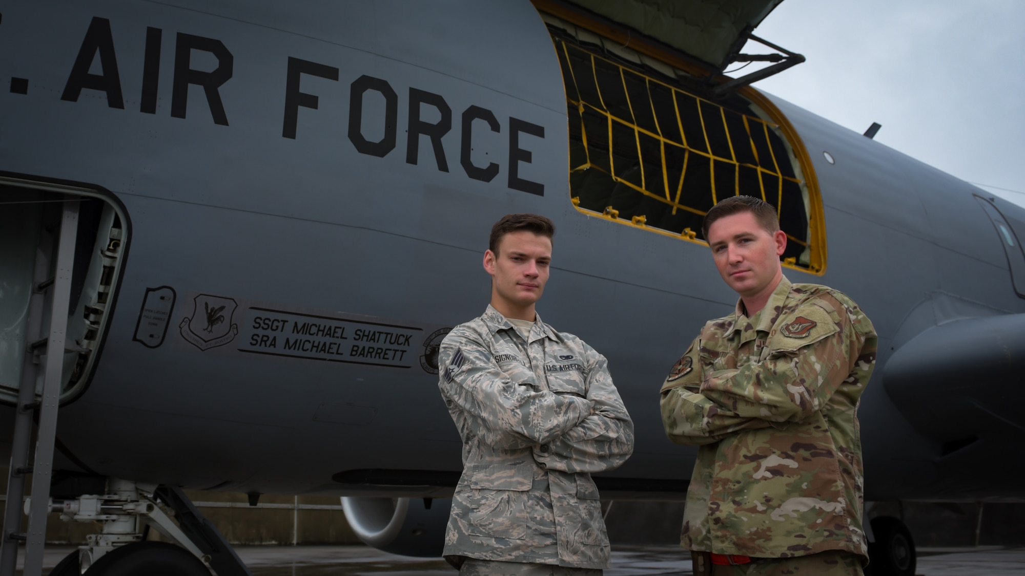 Senior Airman Michael Barrett, left, and Staff Sgt. Michael Shattuck, crew chiefs assigned to the 718th Aircraft Maintenance Squadron poses for a photo on Kadena Air Base, June 24, 2019.