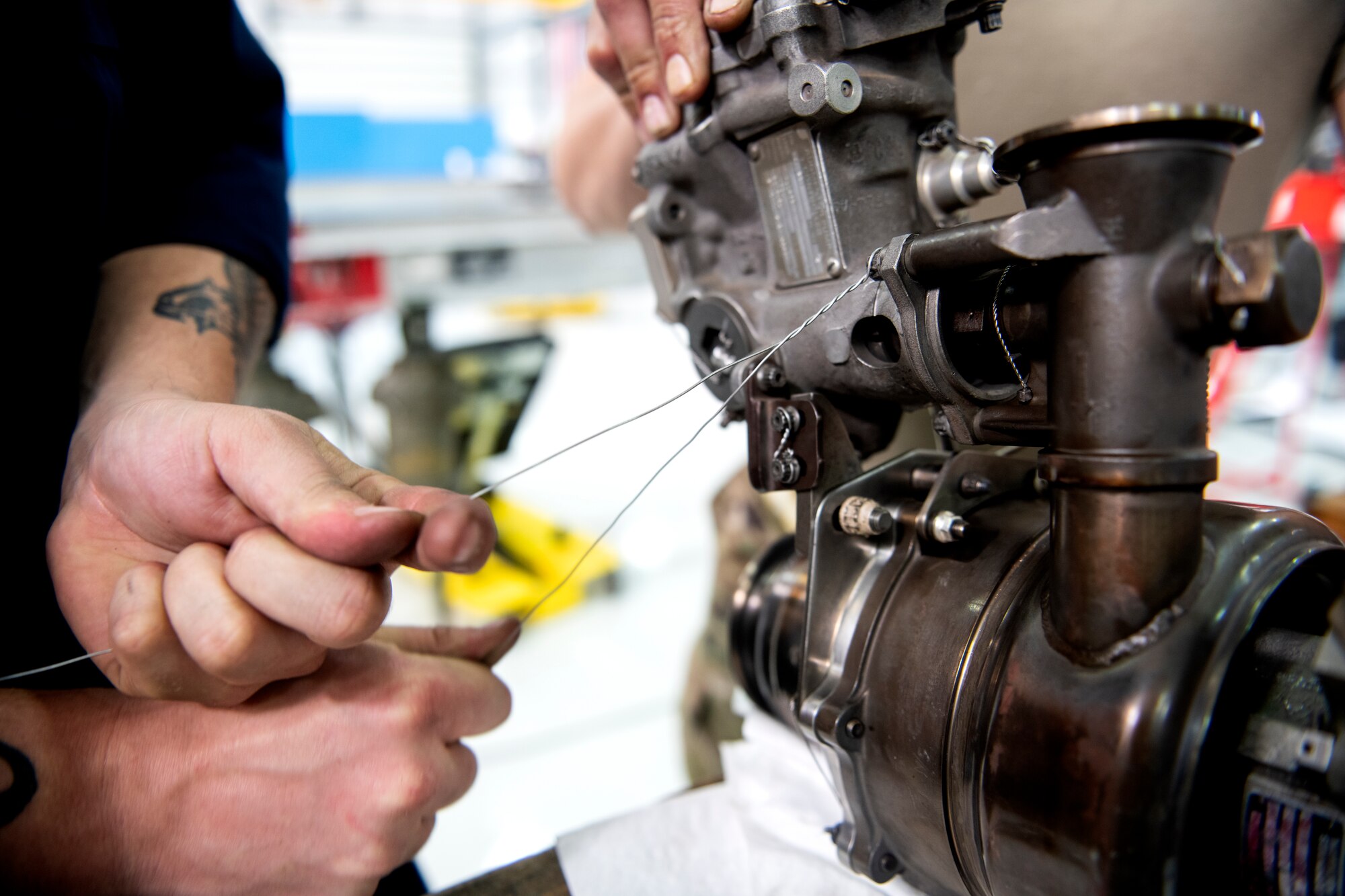 Aerospace technicians, assigned to the 4th Component Maintenance Squadron at Seymour Johnson Air Force Base, North Carolina, repair safety wires while deployed to the 48th CMS Propulsion Flight at Royal Air Force Lakenheath, England, June 20, 2019. Safety wires come in two different sizes to provide stability and helps minimize engine vibration during the flight. Maintainers are deployed to the 48th CMS to assist with the repair of aircraft parts received from deployed locations in the squarons area of operation. (U.S. Air Force photo by Senior Airman Malcolm Mayfield)
