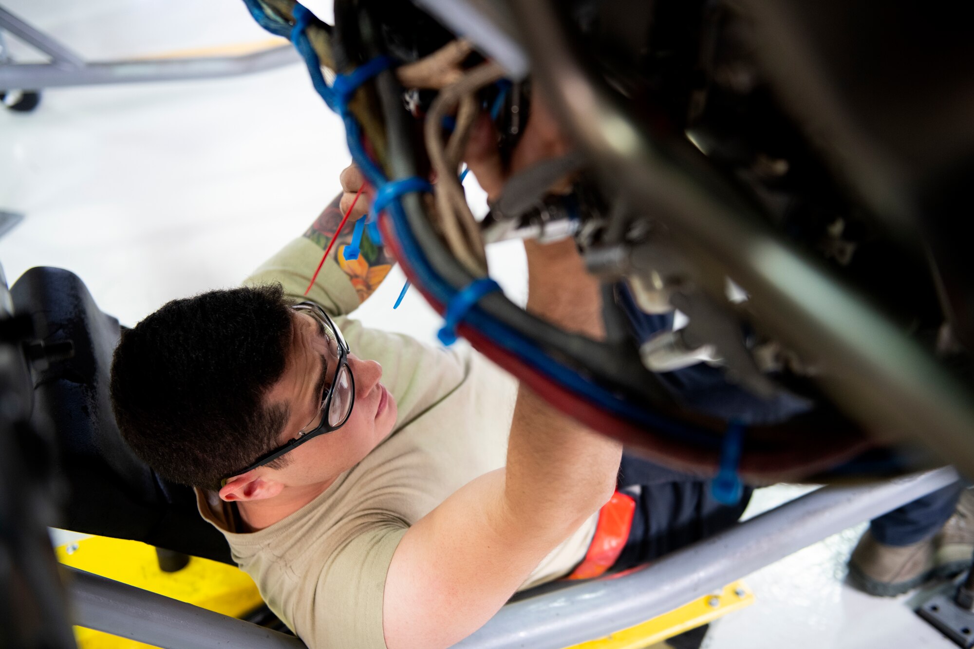 An aerospace technician, assigned to the 48th Component Maintenance Squadron Propulsion Flight, conducts maintenance underneath an F-15 engine at Royal Air Force Lakenheath, England, June 20, 2019. The 48th CMS performs maintenance for equipment used on F-15C Eagles, F-15D Eagles and F-15E Strike Eagles assisting in the accomplishment of U.S. Africa Command, Central Command, European Command, NATO and U.S. Air Force in Europe - Air Forces Africa commitments and taskings. (U.S. Air Force photo by Senior Airman Malcolm Mayfield)