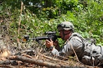 A Pennsylvania National Guard Soldier from A Company, 128th Brigade Support Battalion, 2nd Brigade, 28th Infantry Division, maintain security after a probing attack by opposing force soldiers during eXportable Combat Training Capability 19-02 at Fort Pickett, Va. on June 18, 2019.