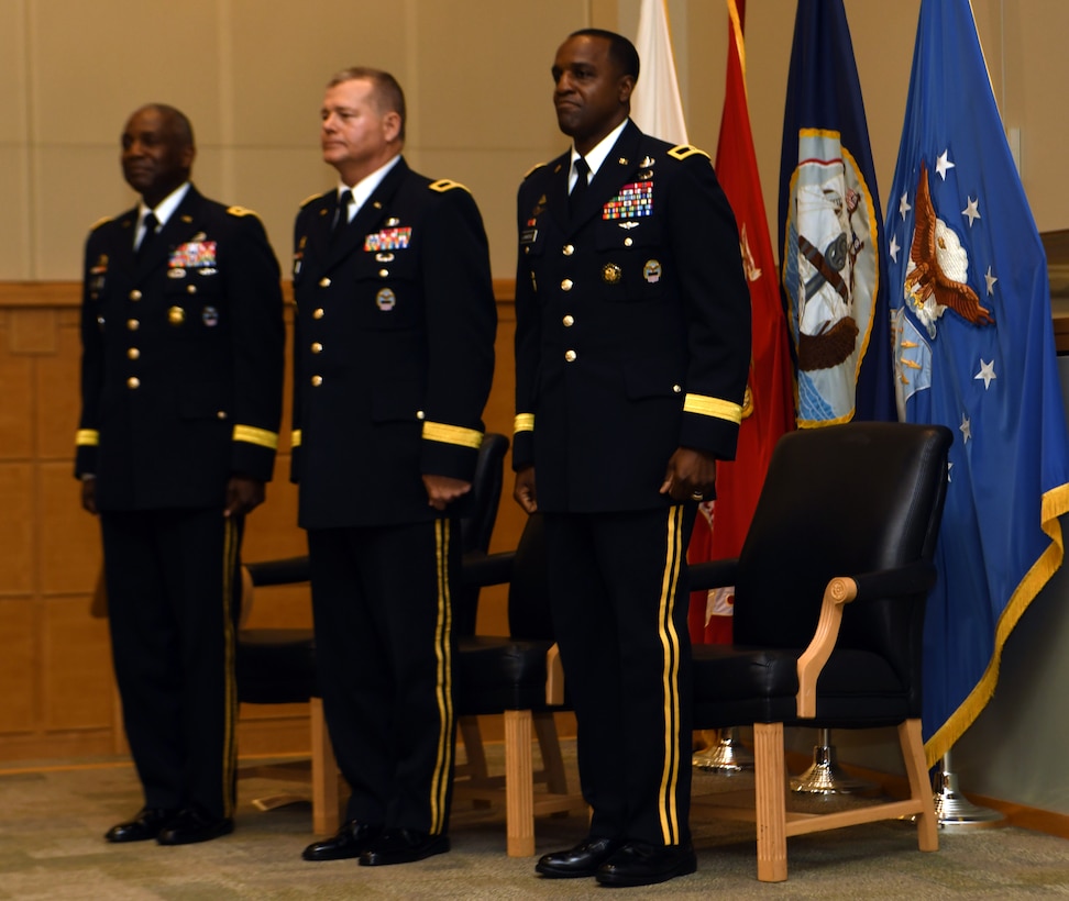DLA Director Army Lt. Gen. Darrell Williams stands to the left of Brig. Gens. Mark Simerly, outgoing DLA Troop Support commander pictured in the center, and Gavin Lawrence, incoming commander pictured to the right, at a ceremony June 25, 2019 in Philadelphia.