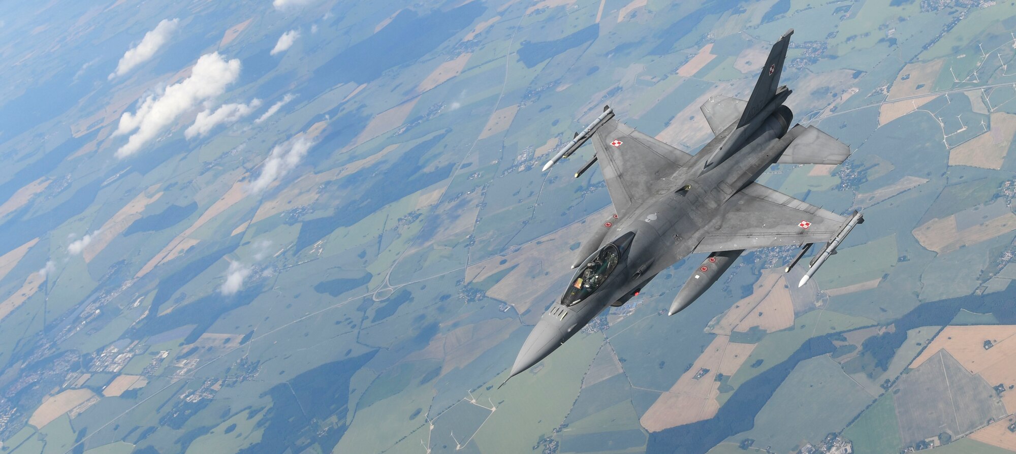 A Polish air force F-16 Fighting Falcon flies beside a U.S. Air Force KC-135 Stratotanker during aerial refueling in support of Exercise Baltic Operations over Germany, June 19, 2019. The BALTOPS Exercise is a U.S. exercise focused on joint interoperability in the Baltic Region, planned and executed this year by the U.S. and NATO. (U.S. Air Force photo by Senior Airman Alexandria Lee)