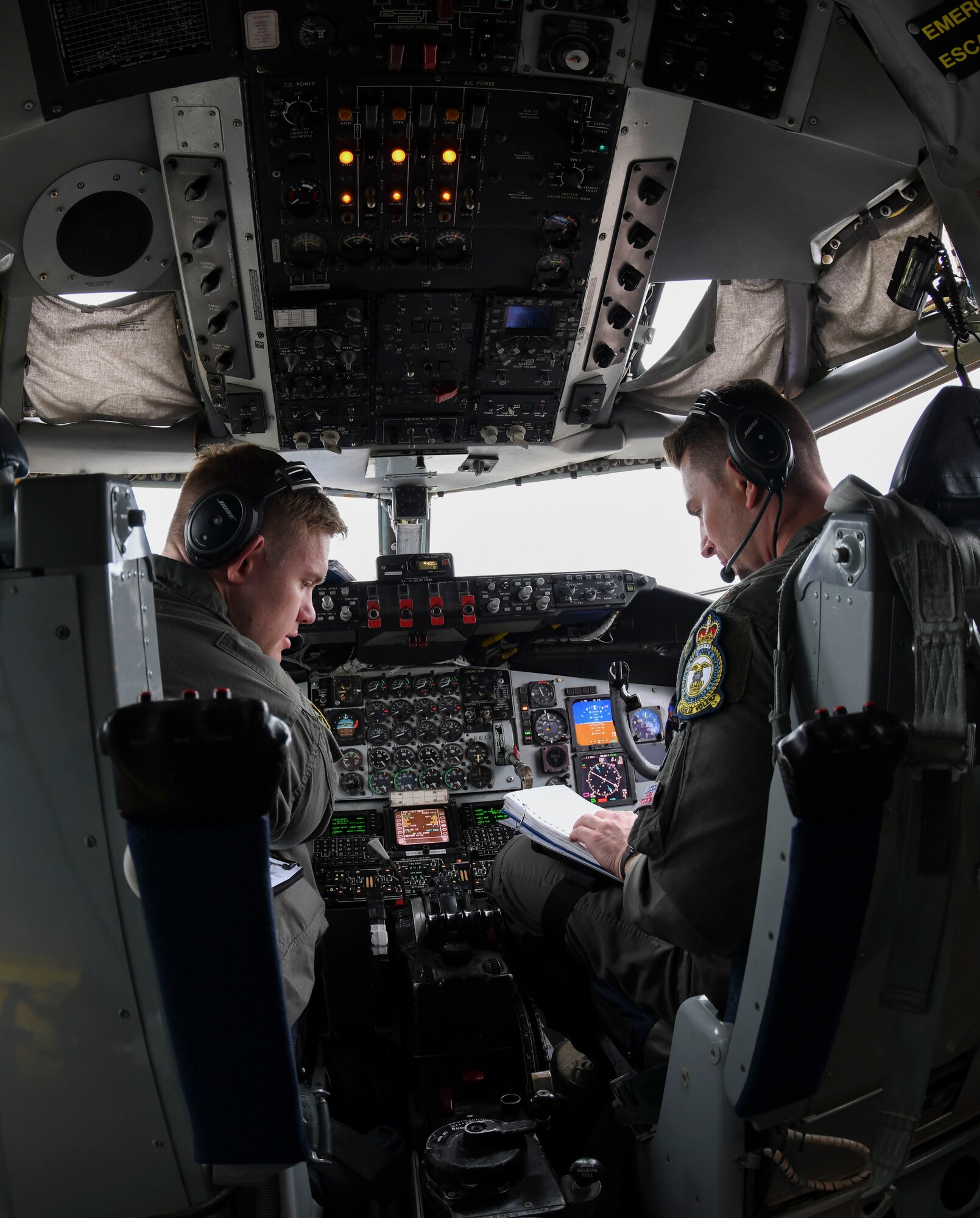 U.S. Air Force Capt. Brendan Keiper and Maj. Patrick Hanson 351st Air Refueling Squadron pilot, review a pre-flight checklist during Exercise Baltic Operations, at RAF Mildenhall, England, June 19, 2019. The BALTOPS Exercise is designed to improve training value for participants, enhance flexibility and interoperability, and demonstrate resolve among allied and partner forces in defending the Baltic Sea region. (U.S. Air Force photo by Senior Airman Alexandria Lee)