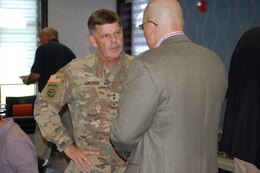 Knox Regional Development Alliance (KRDA) President/CEO Jim Iacocca shares some ideas with Maj. Gen. Flem B. “Donnie” Walker Jr., commanding general, 1st Theater Sustainment Command, during a community luncheon June 25, 2019 in Elizabethtown, Ky.