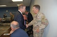 Maj. Gen. Flem B. “Donnie” Walker Jr., commanding general, 1st Theater Sustainment Command, catches up with Daniel London during a community luncheon June 25, 2019 in Elizabethtown, Ky. London, an Army veteran, served under Walker’s command while in Afghanistan.