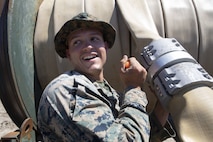 U.S. Marine Corps Cpl. Shane Pizzuto with Bulk Fuel Company, 8th Engineer Support Battalion (ESB), 2nd Marine Logistics Group, unscrews a bolt on a fuel hose clamp during a Bulk Fuel exercise at Camp Lejeune, North Carolina, June 19, 2019 The Marines with 8th ESB ran fuel lines, patrolled the fuel sites and provided all around security to remain proficient in fueling support operations. (U.S. Marine Corps photo by Lance Cpl. Adaezia L. Chavez)