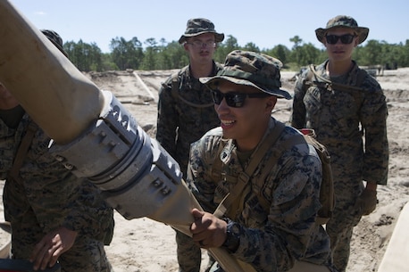 U.S. Marine Corps Cpl. Ivan Quirino with Bulk Fuel Company, 8th Engineer Support Battalion (ESB), 2nd Marine Logistics Group, un-reels a fuel hose during a Bulk Fuel exercise at Camp Lejeune, North Carolina, June 19, 2019. The Marines with 8th ESB ran fuel lines, patrolled the fuel sites and provided all around security to remain proficient in fueling support operations. (U.S. Marine Corps photo by Lance Cpl. Adaezia L. Chavez)