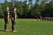 U.S. Marine Corps Lt. Col. Robert P. Gerbracht, left, and Lt. Col. Patrick G. Manson, right, commanding officer of 8th Engineer Support Battalion, 2nd Marine Logistics Group, stand at attention during a change of command ceremony at Camp Lejeune, North Carolina, June 19, 2019. During the ceremony, Manson relinquished command of 8th ESB to Gerbracht