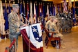 Col. Steve Fabiano addresses an audience of more than 160 service members during his brigade change of command ceremony inside one of Camp As Sayliyah's recreation facilities on June 24, 2019. Fabiano is the new commander of Area Support Group-Qatar.