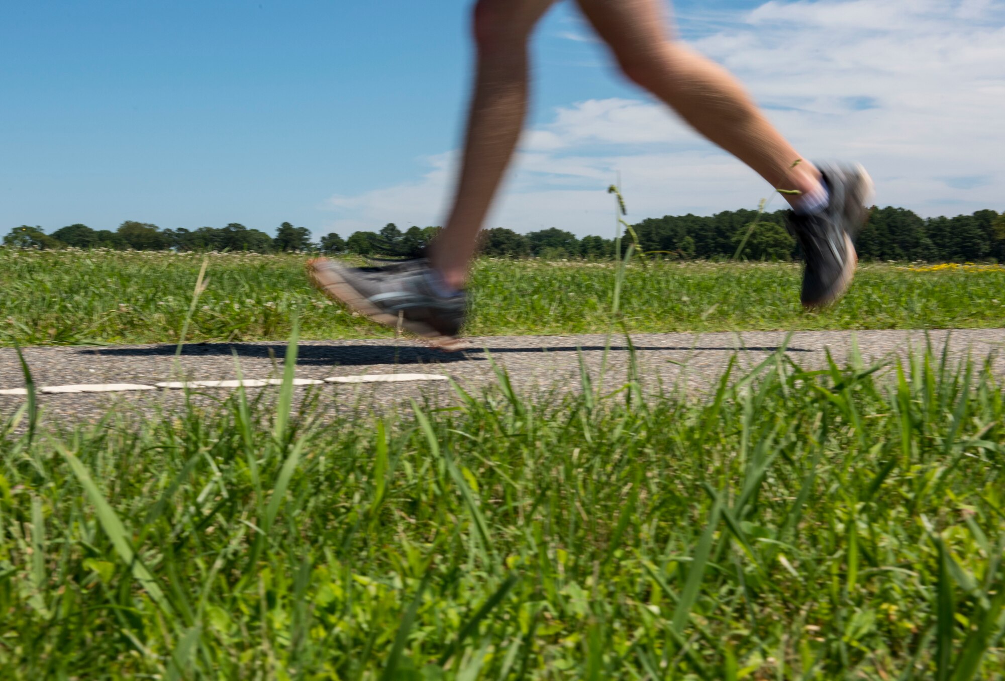U.S. Air Force Airman 1st Class Kalen Norwood, 633rd Communications Squadron cable and antenna systems technician, runs at Joint Base Langley-Eustis, Virginia, June 11, 2019.
