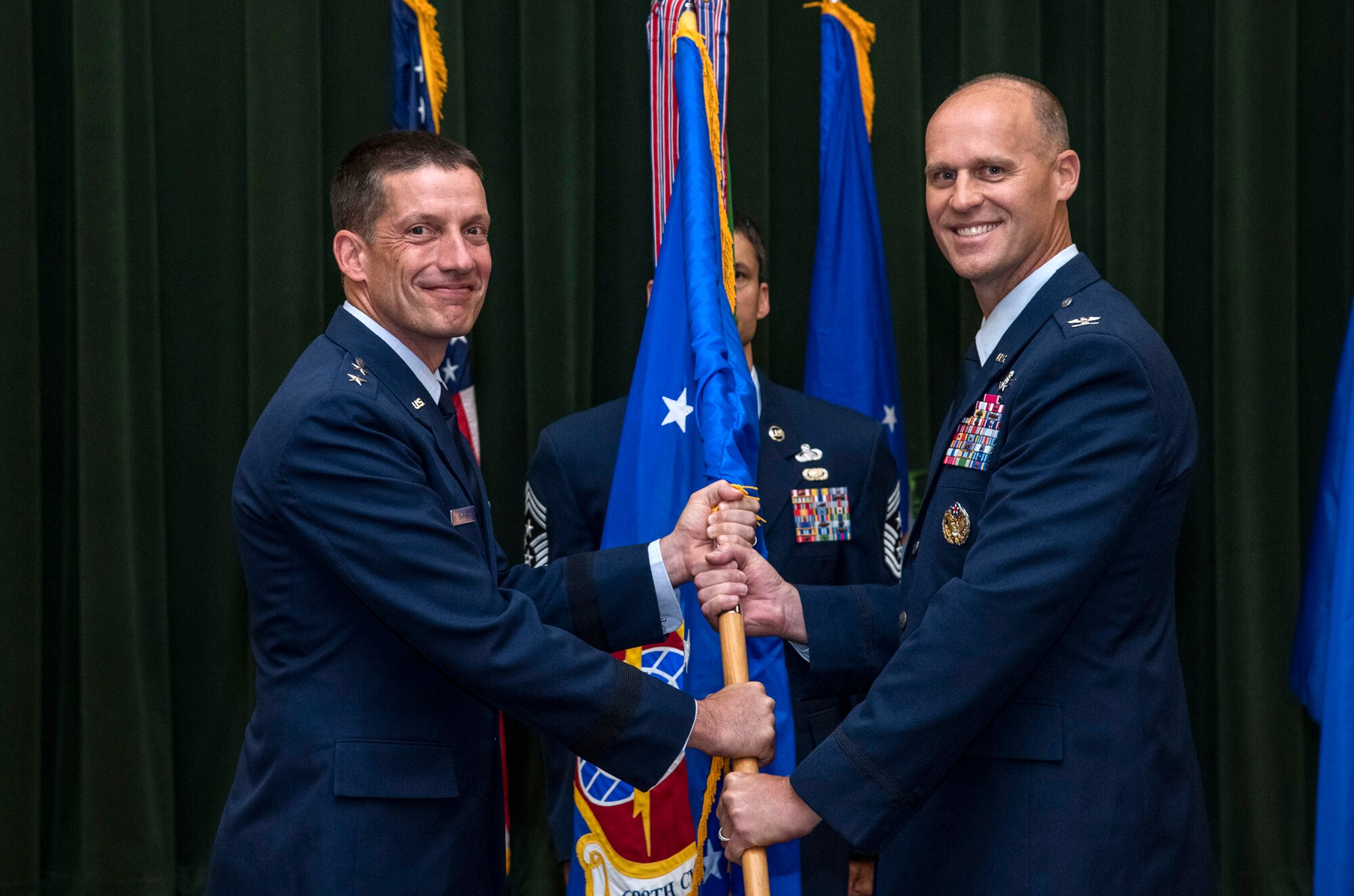 Col. Steven Anderson (right) accepts command of the 688th Cyberspace Wing from Maj. Gen. Robert Skinner, 24th Air Force commander, during the wing’s change of command ceremony at Joint Base San Antonio-Lackland, Texas, on June 25, 2019. Col. Eric DeLange relinquished command of the 688th CW during the ceremony. (U.S. Air Force photo by Johnny Saldivar)