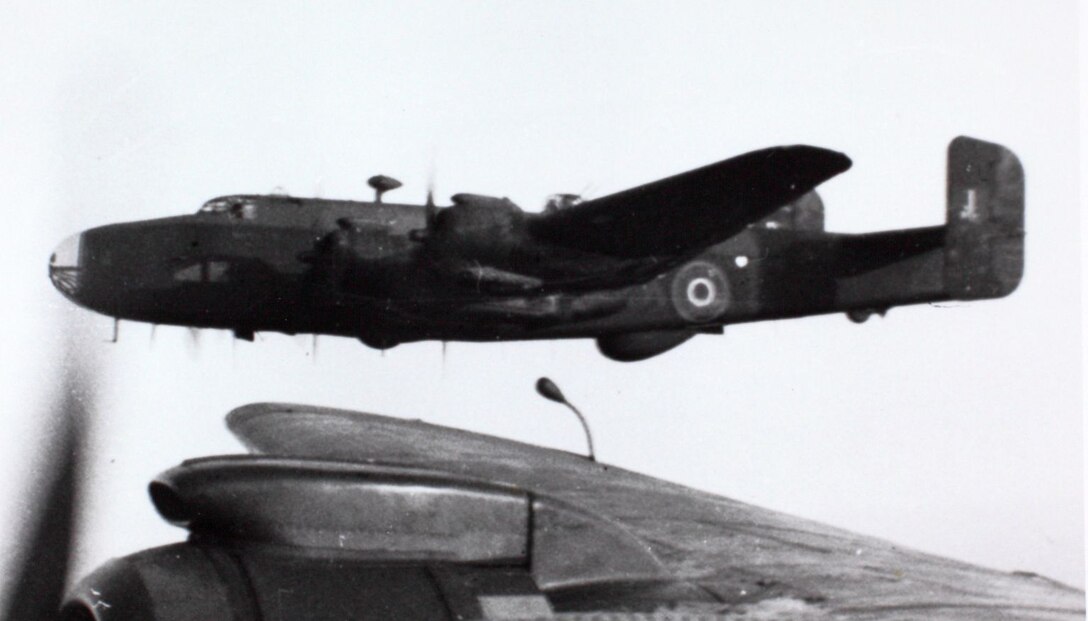 A B-24 Liberator emerges from the heavy smoke after attacking the Xenia oil refinery at Ploesti, Romania, on August1943. The Germans returned the Ploesti refineries back to full production in less than two months.