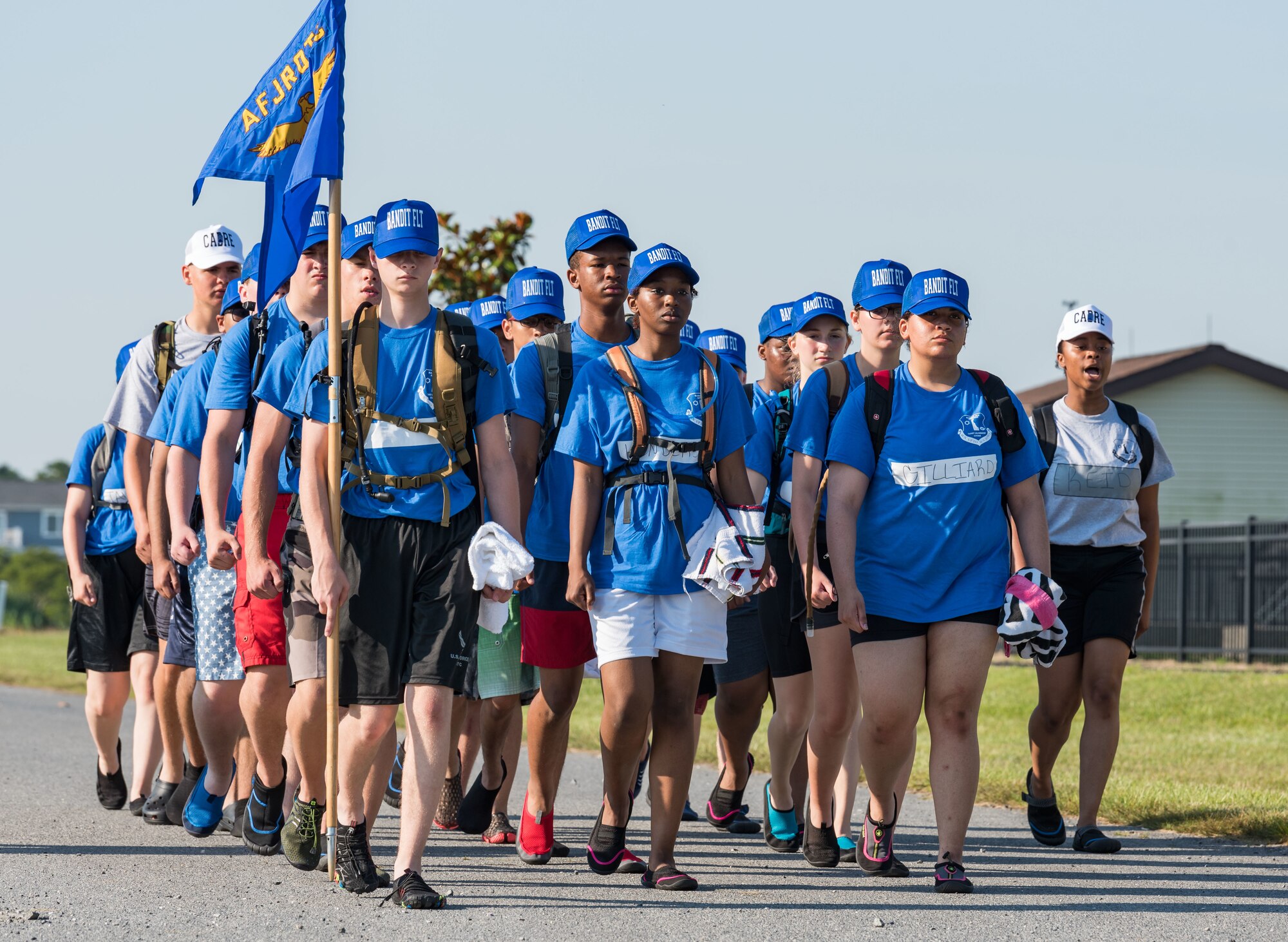 Air Force Junior Reserve Officers’ Training Corps cadet training instructor Nyah Reid, right, marches cadets of Bandit Flight to aircrew water survival class June 17, 2019, at the Delaware National Guard Bethany Beach Training Site, Bethany Beach, Del. Cadets from five Delaware high schools attended the six-day Cadet Leadership Course to enhance their leadership and team-building skills. (U.S. Air Force photo by Roland Balik)