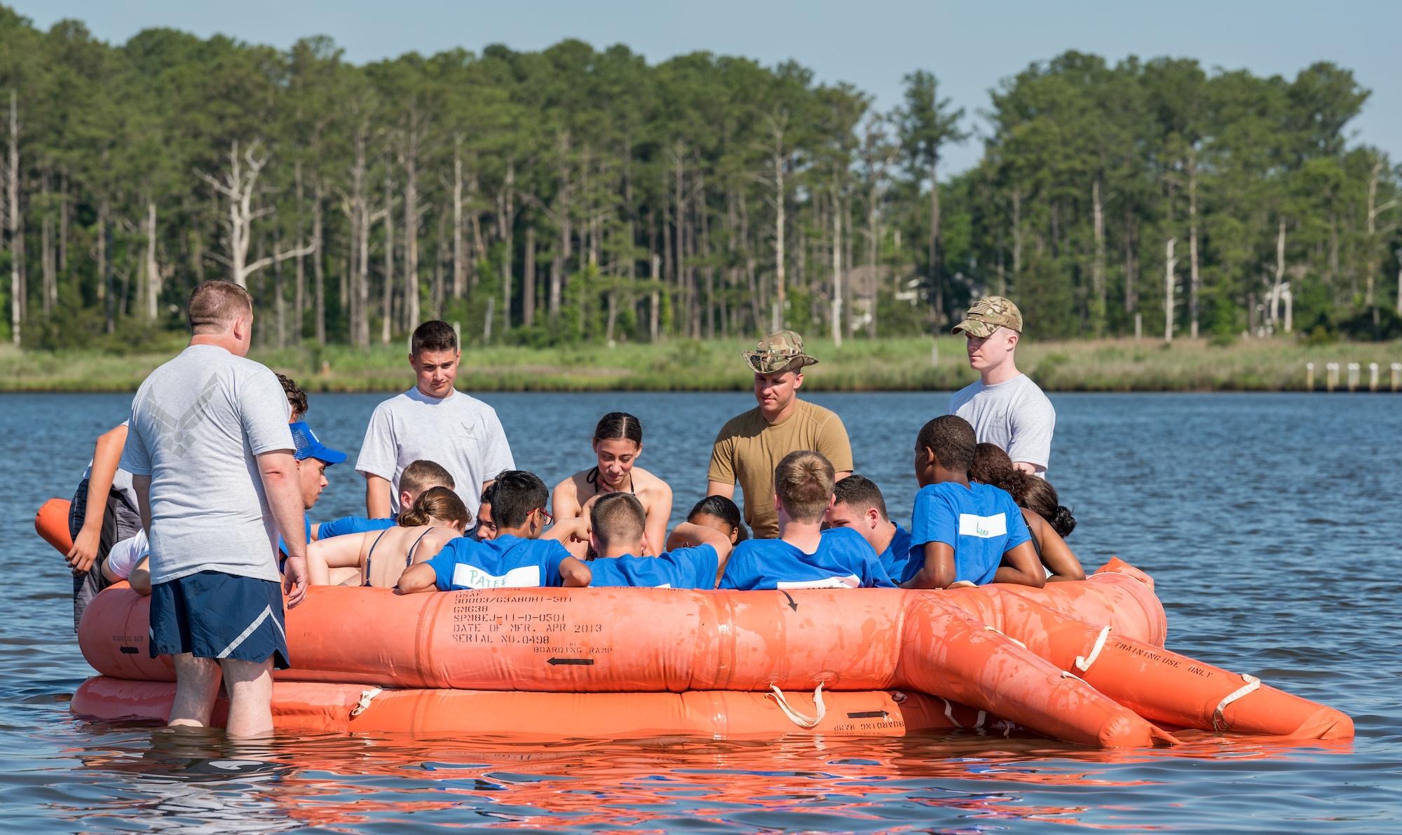 Members of the 142nd Airlift Squadron, New Castle Air National Guard Base, New Castle, Del., teach aircrew water survival skills to Air Force Junior Reserve Officers’ Training Corps cadets of Bandit Flight June 17, 2019, at the Delaware National Guard Bethany Beach Training Site, Bethany Beach, Del. Cadets climbed into a 20-person life raft on the first day of the six-day Cadet Leadership Course. (U.S. Air Force photo by Roland Balik)