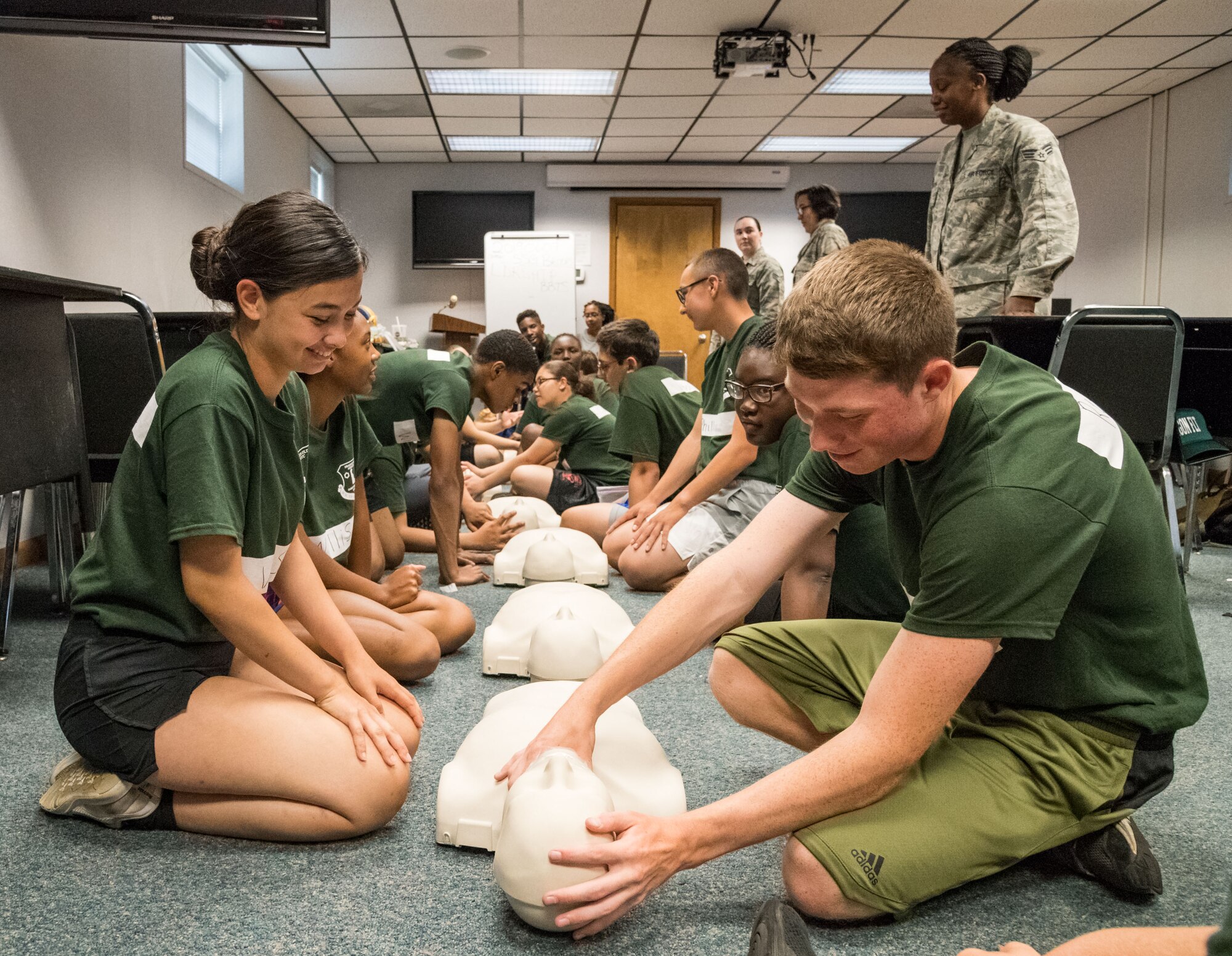 Air Force Junior Reserve Officers’ Training Corps cadets Erica Voss, left, and Trenton Reed, right, of Dragon Flight take turns practicing CPR June 19, 2019, at the Delaware National Guard Bethany Beach Training Site, Bethany Beach, Del. Three members from the 436th Medical Group, Dover Air Force Base, Del., provided basic CPR training to more than 65 cadets during the Cadet Leadership Course. (U.S. Air Force photo by Roland Balik)