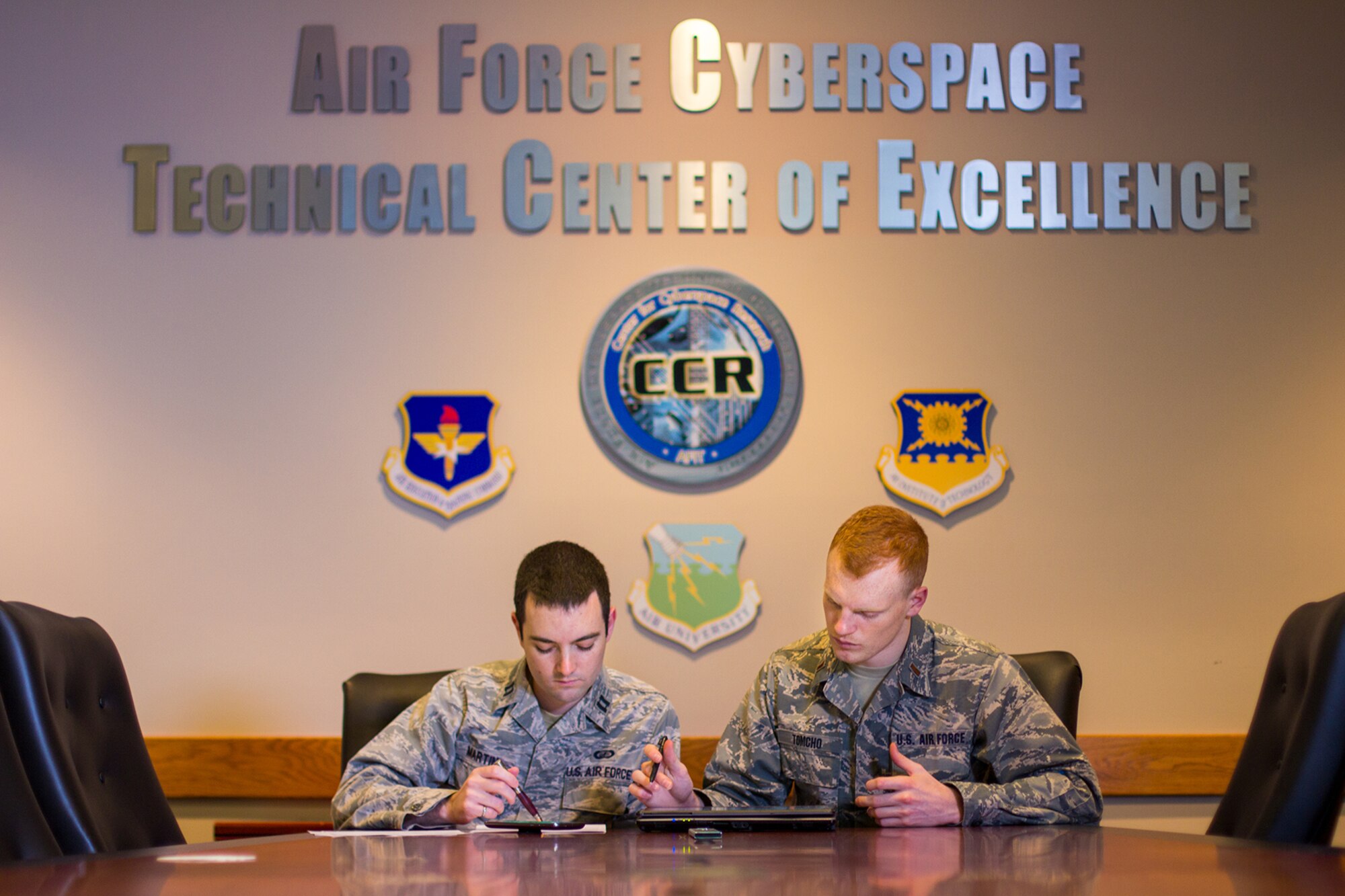 Left to right, Capt. Seth Martin 2nd Lt. Landon Tomcho, earned master’s degrees in cyber operations and computer science from AFIT in 2019 (U.S. Air Force photo/Bruce Lambert)