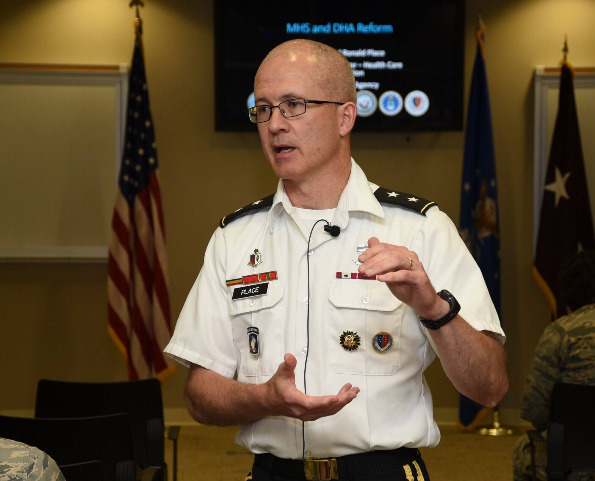 Photo coverage of Maj. Gen. Ronald Place, acting assistant director of healthcare administration, Defense Health Agency, speaking to a townhall at the 72nd Medical Group regarding the upcoming realignment of healthcare from individual service (Air Force) responsibility to the Defense Health Agency June 25, 2019, Tinker Air Force Base, Oklahoma. The move of healthcare services from individual service responsiblity to DHA is expected to be transparent to users with the intent of focusing resources to medical combat readiness for servicemembers. (U.S. Air Force photo/Greg L. Davis)