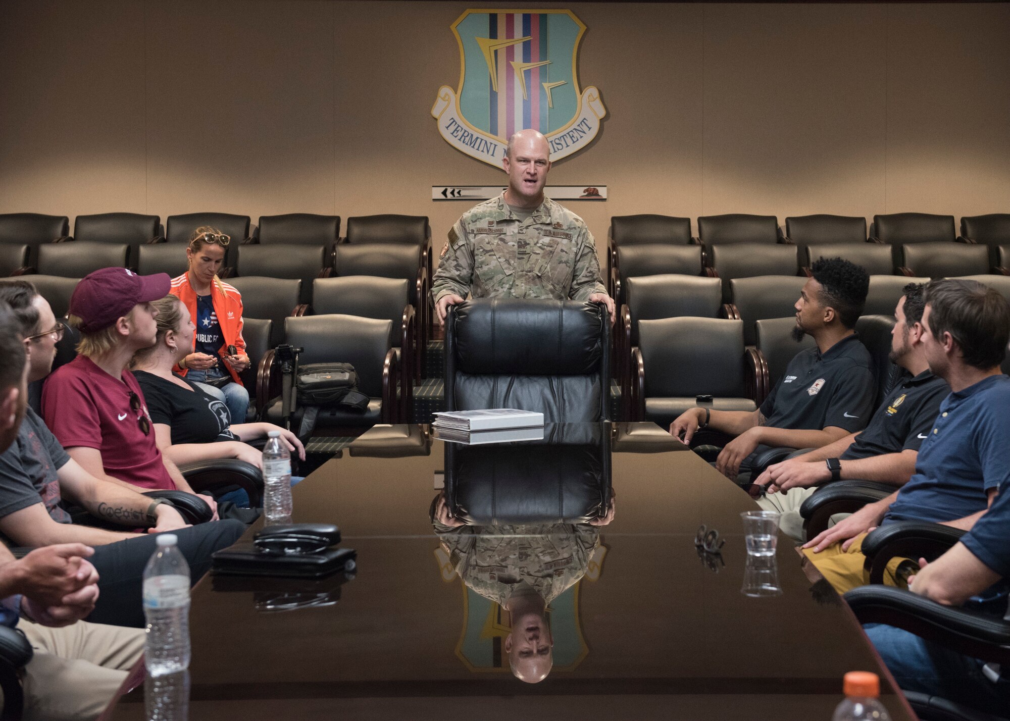 U.S. Air Force Col. David Hammerschmidt, 60th Maintenance Group commander, speaks to the Sacramento Republic Football Club staff members June 24, 2019, at Travis Air Force Base, California. The professional soccer team received a welcome brief and a tour of the C-5M Super Galaxy before playing a match alongside Team Travis Airmen. (U.S. Air Force photo by Staff Sgt. Amber Carter)