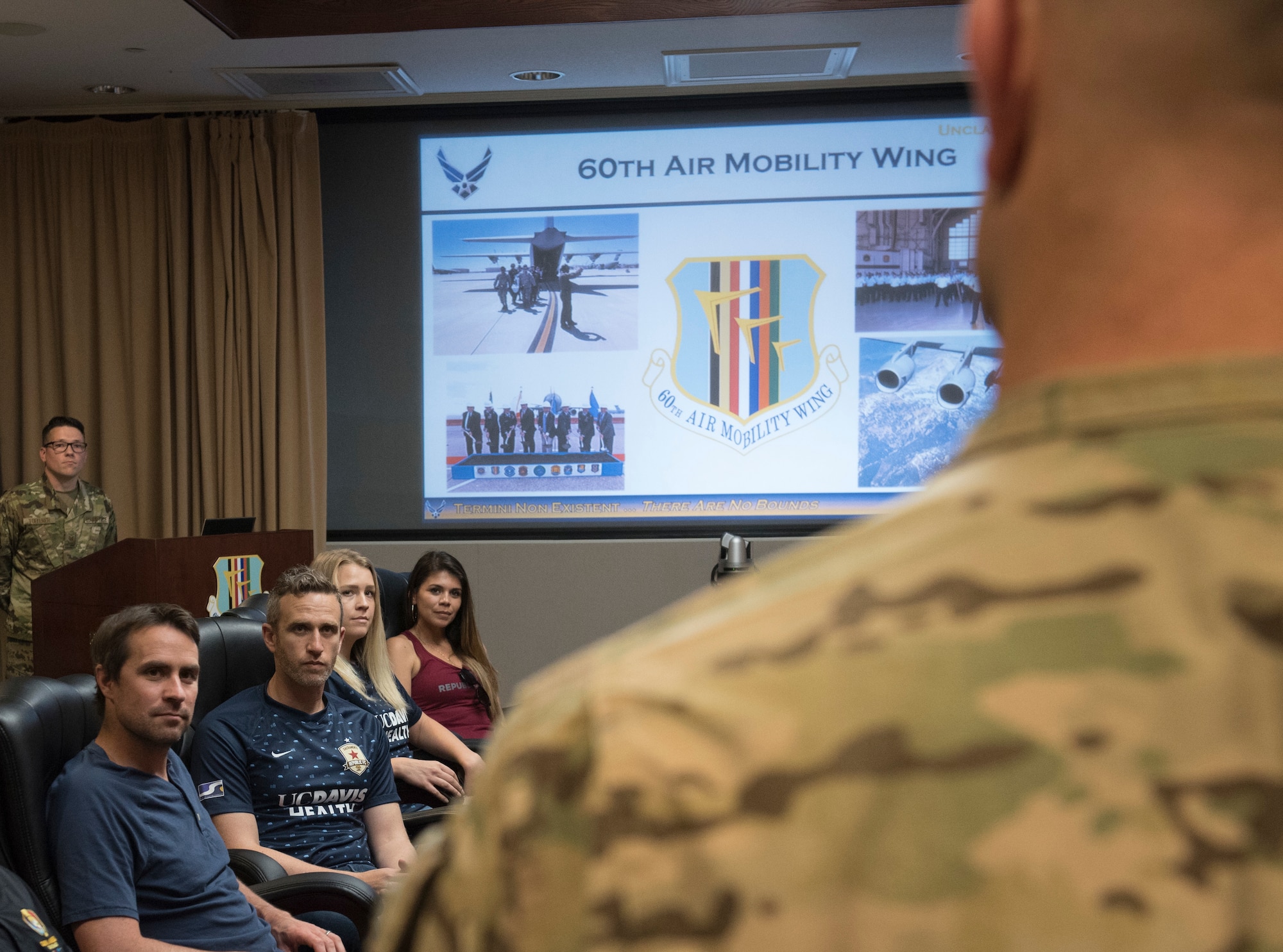U.S. Air Force Col. David Hammerschmidt, 60th Maintenance Group commander, speaks to the Sacramento Republic Football Club staff members June 24, 2019, at Travis Air Force Base, California. The professional soccer team received a welcome brief and a tour of the C-5M Super Galaxy before playing a match alongside Team Travis Airmen. (U.S. Air Force photo by Staff Sgt. Amber Carter)