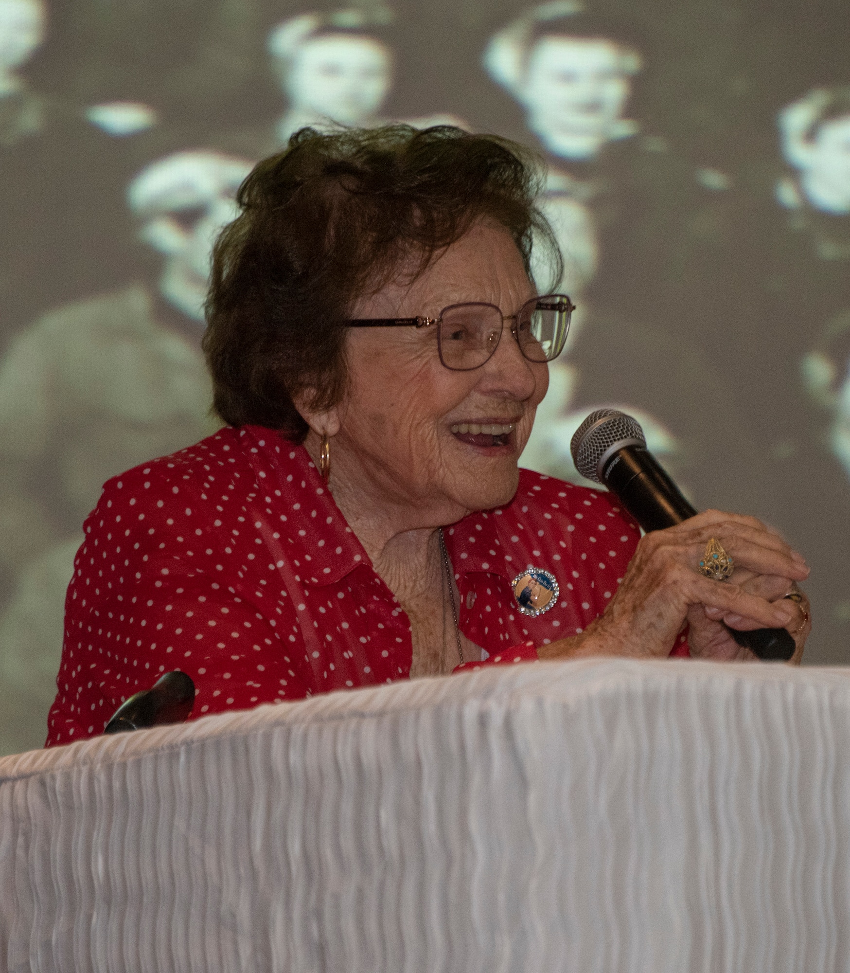Agnes Moore, 99, journeyman welder from 1942-1945, delivers remarks during a base visit June 25, 2019, at Travis Air Force Base, California. Wynn, one of the original Rosie the Riveters, was at Travis AFB to share experiences with female maintainers assigned to the 60th Maintenance Group. Used in movies, newspapers, posters, photographs and articles, the Rosie the Riveter campaign stressed the patriotic need for women to enter the workforce during World War II. Though women filled many positions during the war, the aviation industry saw the greatest increase in female workers. (U.S. Air Force photo by Heide Couch)