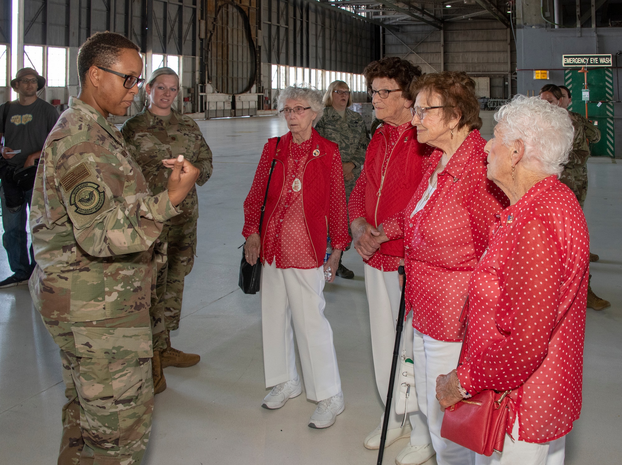 U.S. Air Force Senior Master Sgt. Enden Harrington, 660th Aircraft Maintenance Squadron lead production superintendent, speaks with members of the original Rosie the Riveters June 25, 2019, at Travis Air Force Base, California. The Rosies, who are all in their 90s, were at Travis AFB to share experiences with female maintainers assigned to the 60th Maintenance Group. Used in movies, newspapers, posters, photographs and articles, the Rosie the Riveter campaign stressed the patriotic need for women to enter the workforce during World War II. Though women filled many positions during the war, the aviation industry saw the greatest increase in female workers. (U.S. Air Force photo by Heide Couch)