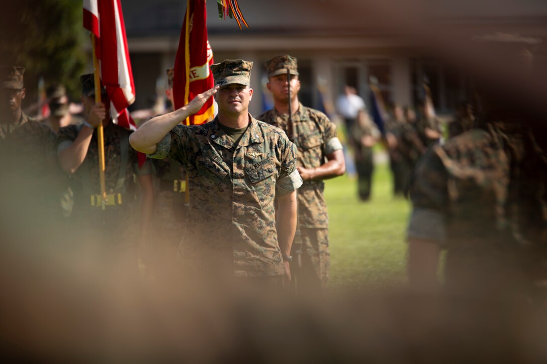 Lt. Col. Jeffrey  S. Pelt salutes during the Headquarters and Headquarters Squadron change of command ceremony aboard Marine Corps Air Station Beaufort, June 21. During the ceremony Lt. Col. Anthony A. Tilelli relieved Pelt.
