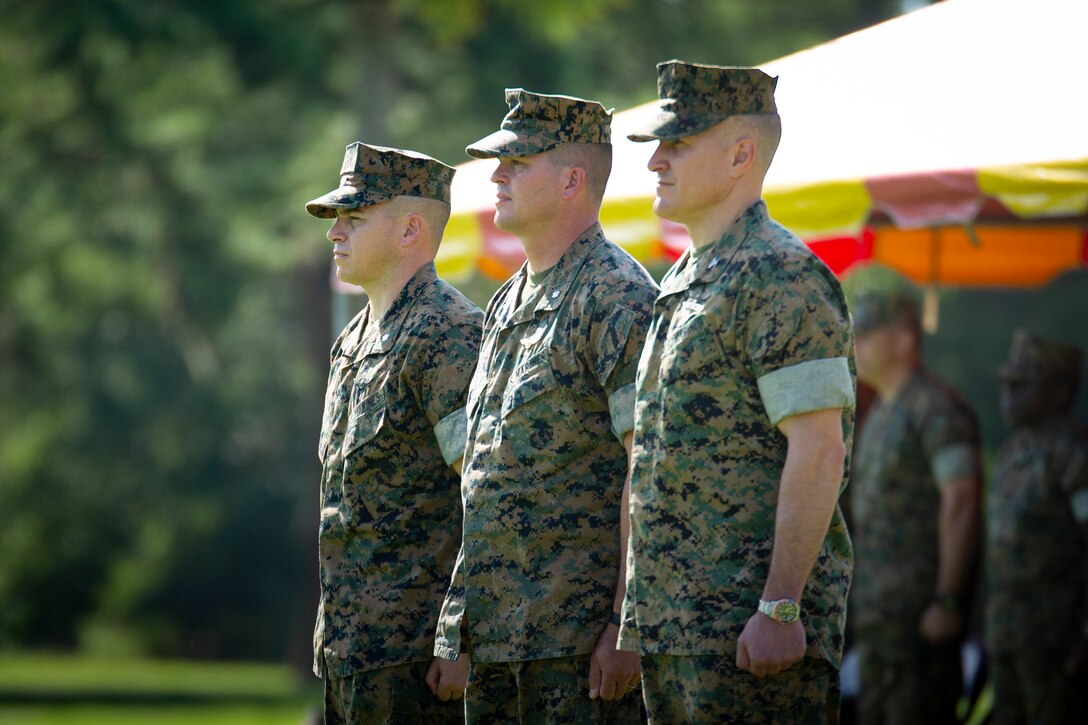 Lt. Col. Anthony A. Tilelli, left, relieves Lt. Col. Jeffrey S. Pelt, middle, during the Headquarters and Headquarters Squadron change of command ceremony aboard Marine Corps Air Station Beaufort, June 21. During the ceremony all previous commanders of H&HS were also invited to the reviewing area.
