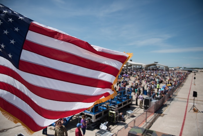 Spectators gather for a flying display of the main act of Wings over Whiteman Air & Space Show 2019, the F-22 Demonstration Team, at Whiteman Air Force Base, Missouri, June 15, 2019. Over the course of two days, more than 100,000 visitors attended flying and static displays of aircraft and military equipment. (U.S. Air Force photo by Tech. Sgt. Alexander W. Riedel)