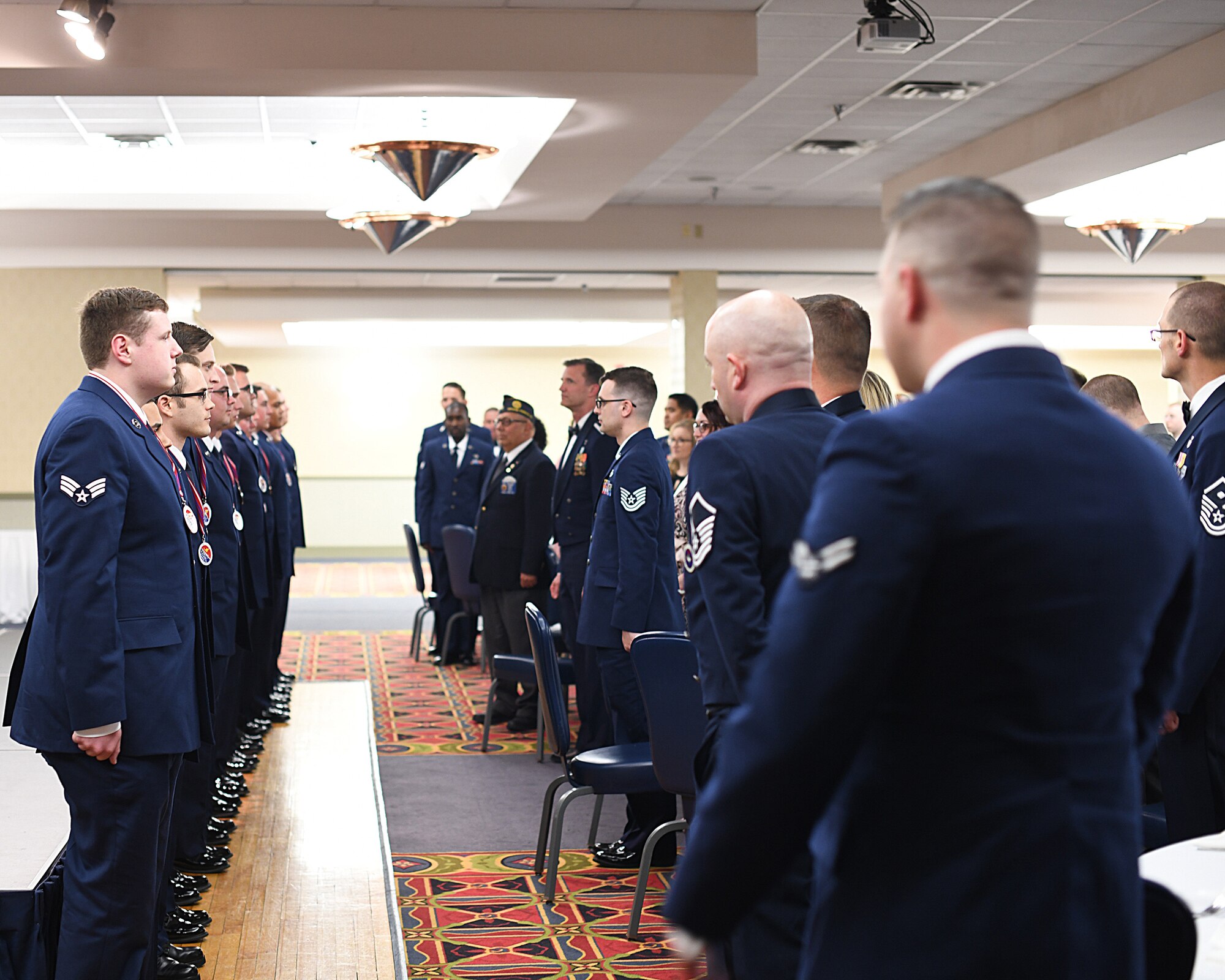 Etchberger Airman Leadership School graduates line up to be recognized at the conclusion of the ALS graduation ceremony, June 20, 2019, on Grand Forks Air Force Base, North Dakota. ALS graduation is the culmination of the first level of the Enlisted Professional Military Education continuum directed toward preparing upcoming noncommissioned officers with leadership skills for their careers. (U.S. Air Force photo by Senior Airman Elijaih Tiggs)