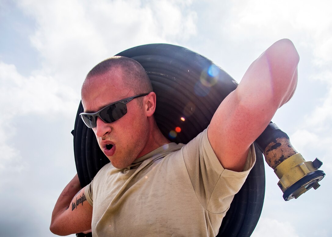 Tech. Sgt. Bryan Winterstein, 23d Logistics Readiness Squadron (LRS) fuels distribution quality assurance inspector, carries a fuel line hose during Forward Area Refueling Point (FARP) team tryouts, June 21, 2019, at Moody Air Force Base, Ga. The FARP team is made up of Airmen from the 23d LRS Petroleum, Oils and Lubricants flight that are responsible for providing needed fuel to aircraft in a rapid manner. In order to become fully qualified, FARP team members must undergo a rigorous amount of continuous physical and mental training to ensure they’re fit for duty. Following the tryouts the Airmen were interviewed to further evaluate their mental readiness to join the FARP team and ultimately one Airman will be chosen. (U.S. Air Force photo by Airman 1st Class Eugene Oliver)
