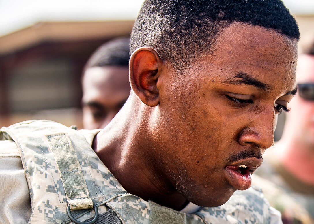 Airman 1st Class Demari Carr, 23d Logistics Readiness Squadron (LRS) fuels distribution operator, catches his breath following the Forward Area Refueling Point (FARP) tryouts, June 21, 2019, at Moody Air Force Base, Ga. Eleven Airmen from the 23d LRS Petroleum, Oils and Lubricants flight were judged and evaluated on their ability to carry various fueling equipment to and from checkpoints as quickly as possible. The FARP team’s mission requires for them to carry heavy fueling equipment to and from aircraft in a quick manner, so the tryouts were designed to gauge Airmen’s physical readiness to complete their mission. Following the tryouts the Airmen were interviewed to further evaluate their mental readiness to join the FARP team and ultimately one Airman will be chosen.  (U.S. Air Force photo by Airman 1st Class Eugene Oliver)