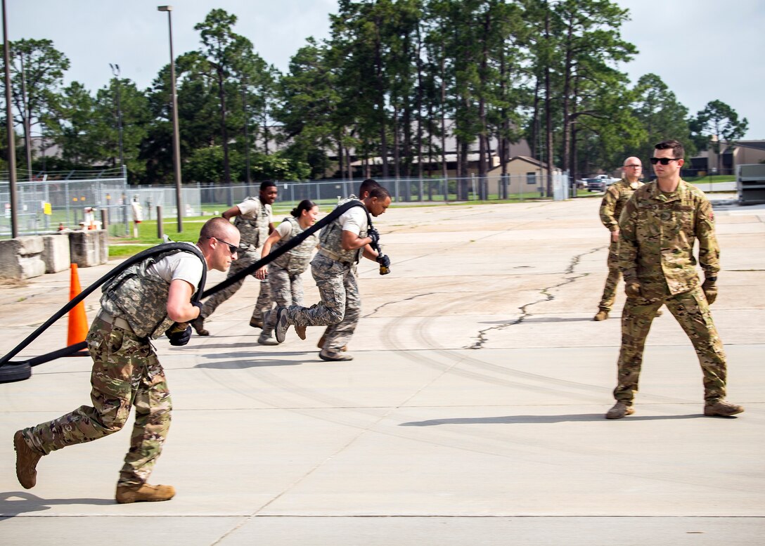 Airmen from the 23d Logistics Readiness Squadron, pull fuel line hoses during Forward Area Refueling Point (FARP) team tryouts, June 21, 2019, at Moody Air Force Base, Ga. Eleven Airmen from the 23d LRS Petroleum, Oils and Lubricants flight were judged and evaluated on their ability to carry various fueling equipment to and from checkpoints as quickly as possible. The FARP team’s mission requires for them to carry heavy fueling equipment to and from aircraft in a quick manner, so the tryouts were designed to gauge Airmen’s physical readiness to complete their mission. Following the tryouts the Airmen were interviewed to further evaluate their mental readiness to join the FARP team and ultimately one Airman will be chosen. (U.S. Air Force photo by Airman 1st Class Eugene Oliver)