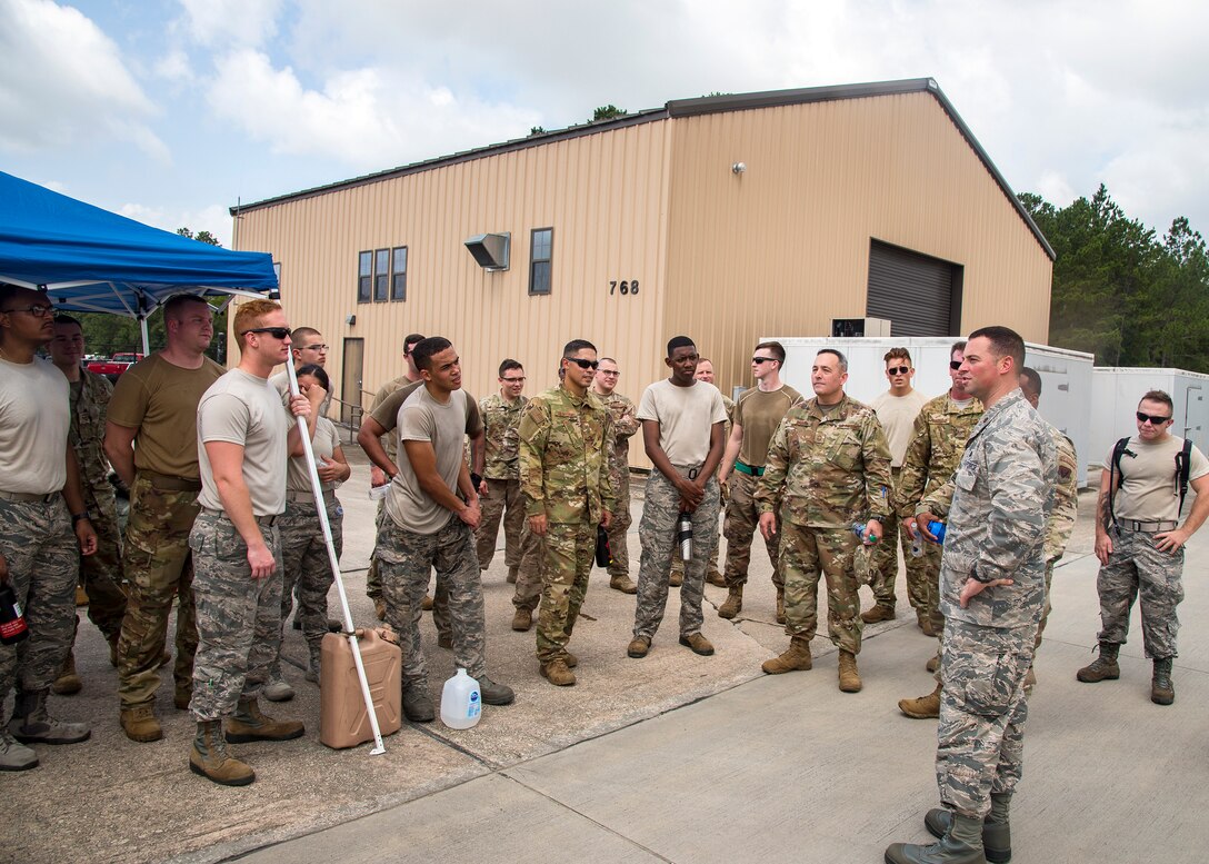 Maj. Vincent Adamo, 23d Logistics Readiness Squadron commander, speaks to Airmen following the Forward Area Refueling Point (FARP) tryouts, June 21, 2019, at Moody Air Force Base, Ga. Eleven Airmen from the 23d LRS Petroleum, Oils and Lubricants flight were judged and evaluated on their ability to carry various fueling equipment to and from checkpoints as quickly as possible. The FARP team’s mission requires for them to carry heavy fueling equipment to and from aircraft in a quick manner, so the tryouts were designed to gauge Airmen’s physical readiness to complete their mission. Following the tryouts the Airmen were interviewed to further evaluate mental their readiness to join the FARP team and ultimately one Airman will be chosen. (U.S. Air Force photo by Airman 1st Class Eugene Oliver)