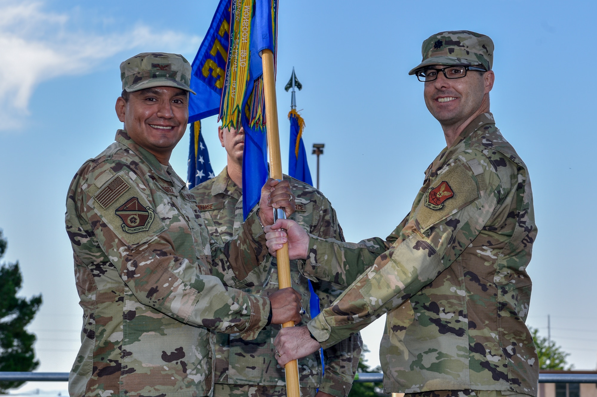 U.S. Air Force Col. Juan Alvarez (left), 377th Mission Support Group commander, gives the guidon to Lt. Col. Daniel Rigsbee, 377th Force Support Squadron commander, at a change of command ceremony at Kirtland Air Force Base, N.M., June 26, 2019. The mission of the 377th FSS is to provide combat readiness through recruitment and development of a high quality workforce while promoting healthy and enriched lifestyles for all Kirtland personnel. (U.S. Air Force photo by Airman 1st Class Austin J. Prisbrey)