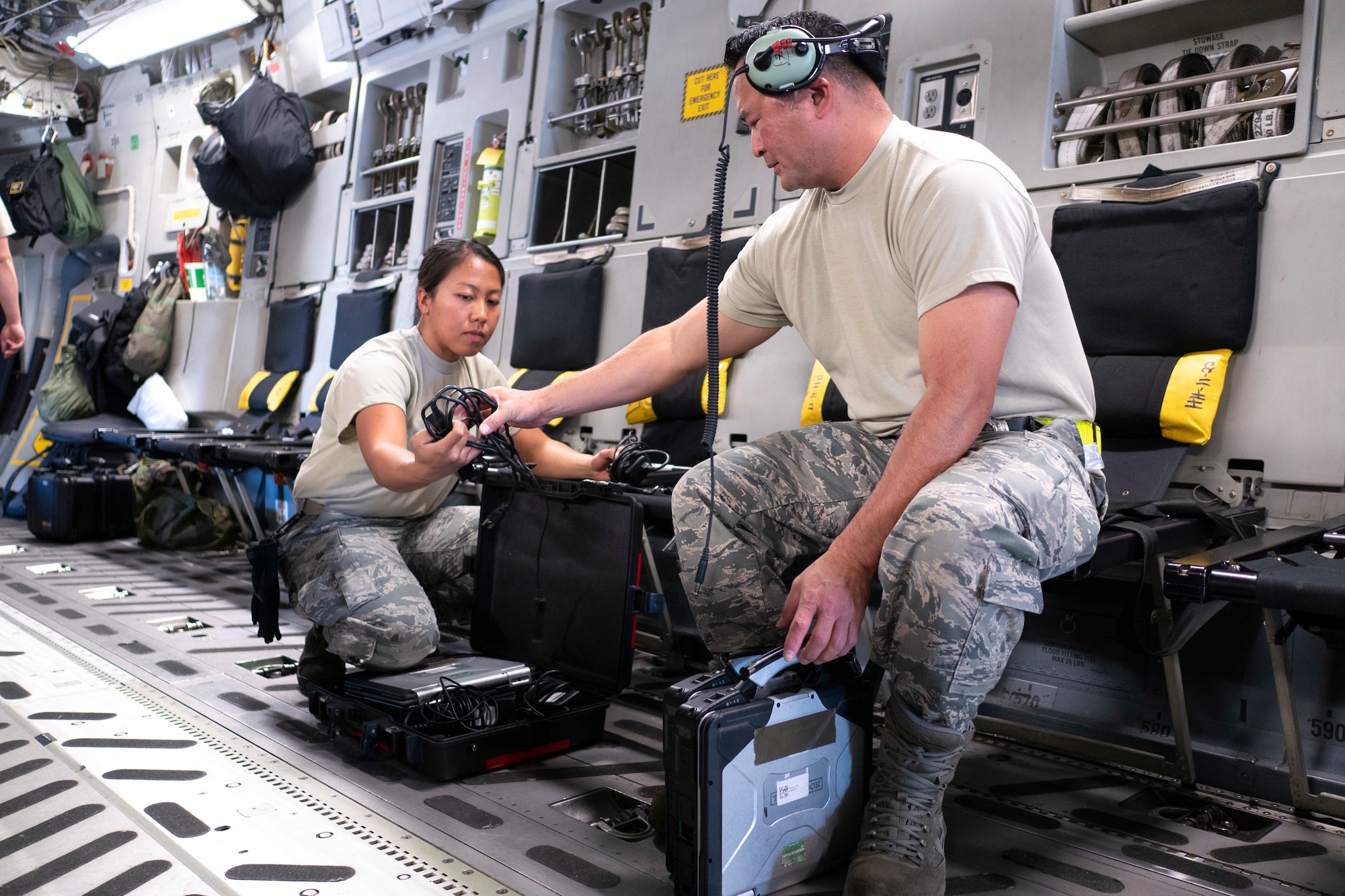 Staff Sgt. Michelle Ganoy, 154th Maintenance Squadron crew chief, and Master Sgt. Rodd Maeyoshimoto, 154 Aircraft Maintenance Squadron integrated instrument and flight control lead technician, prep a C-17 Globemaster III for flight June 17, 2019, at Ramstein Air Base, Germany.