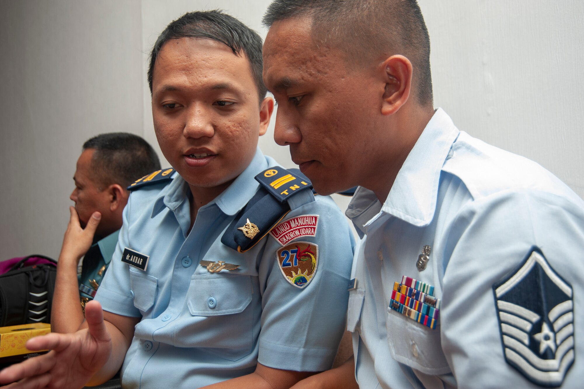 Master Sgt. Bobby-Jo Balmonte 154th Medical Group, Detachment 1 logistics specialist discusses logistical challenges of responding to a pandemic crisis with 1st Lt. Akbar Ikram, flight surgeon with the Tentara Nasional Indonesia during a subject matter expert exchange held Jun. 17, 2019 in Jakarta, Indonesia.