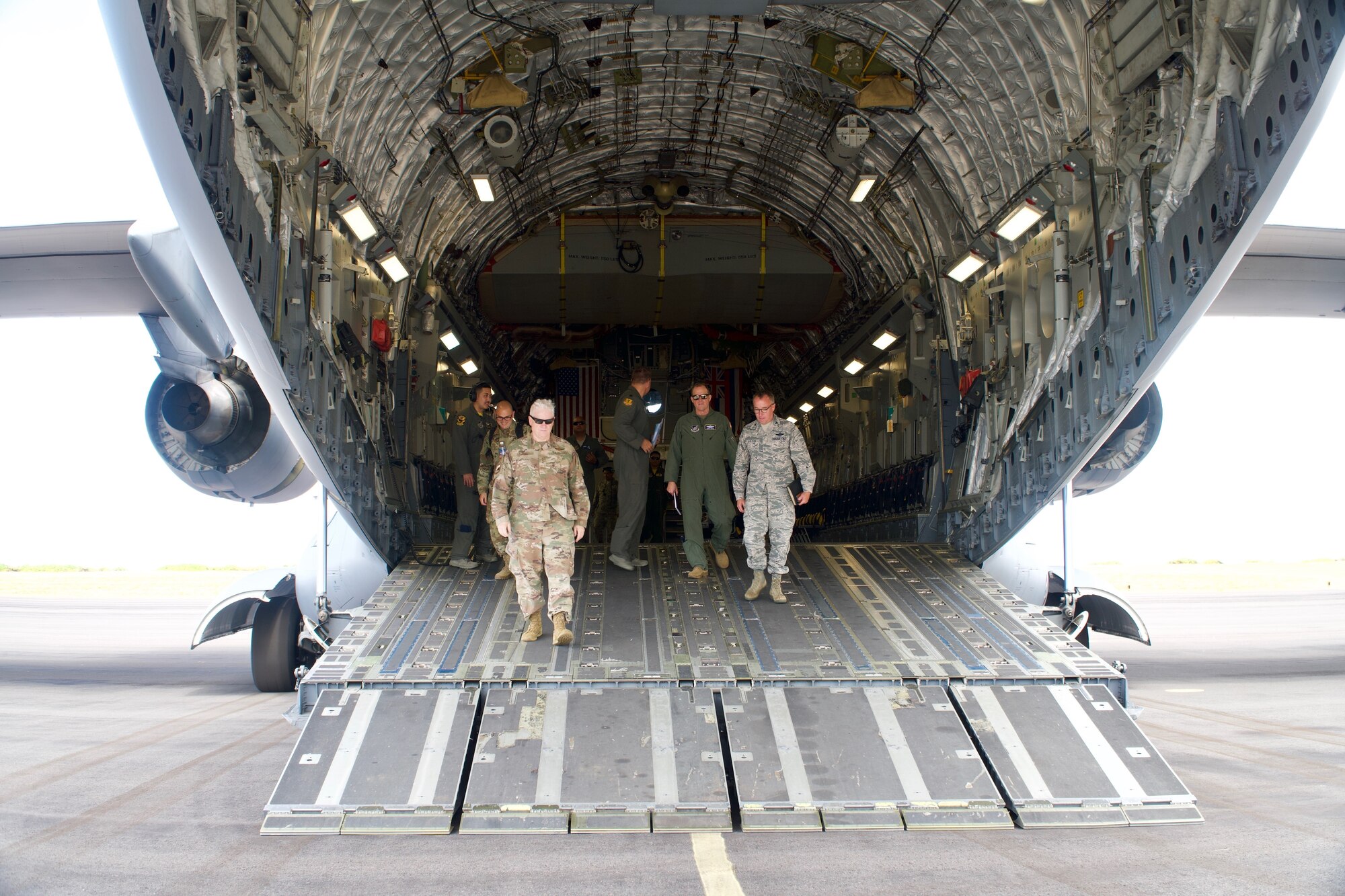 Lt. Gen. L. Scott Rice, Director of the Air National Guard, walks down the ramp of a C-17, Globemaster III, assigned to the 204th Airlift Squadron where they provided transport to the island of Kauai where he met with Airmen on June 21, 2019 at Barking Sands